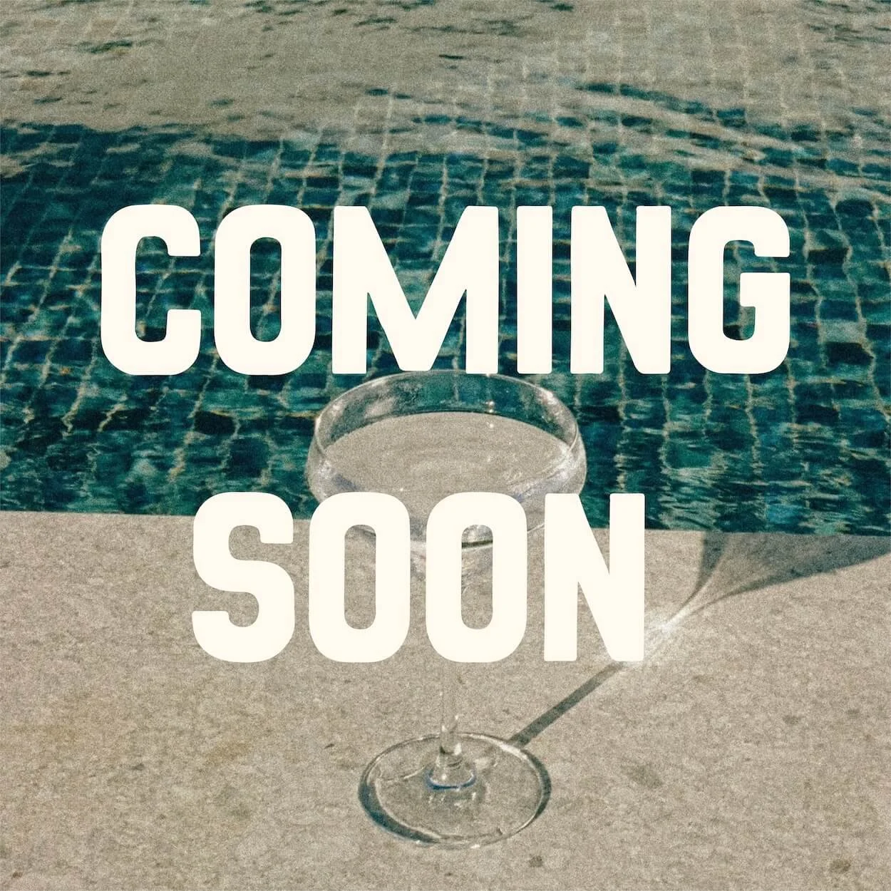 A glass of margarita with a pool in the background and the text 'Coming Soon' over the image.