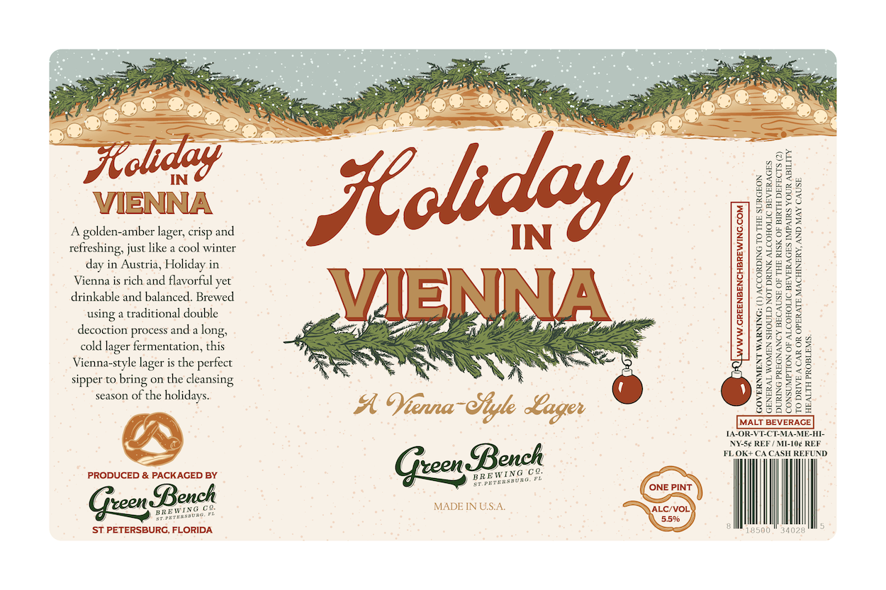 Christmas-themed beer label for 'Holiday in Vienna' Vienna-style lager with pine branches, ornaments, and a pretzel illustration. Green Bench Brewing Co. logo, made in the USA, 5.5% alcohol, one pint.