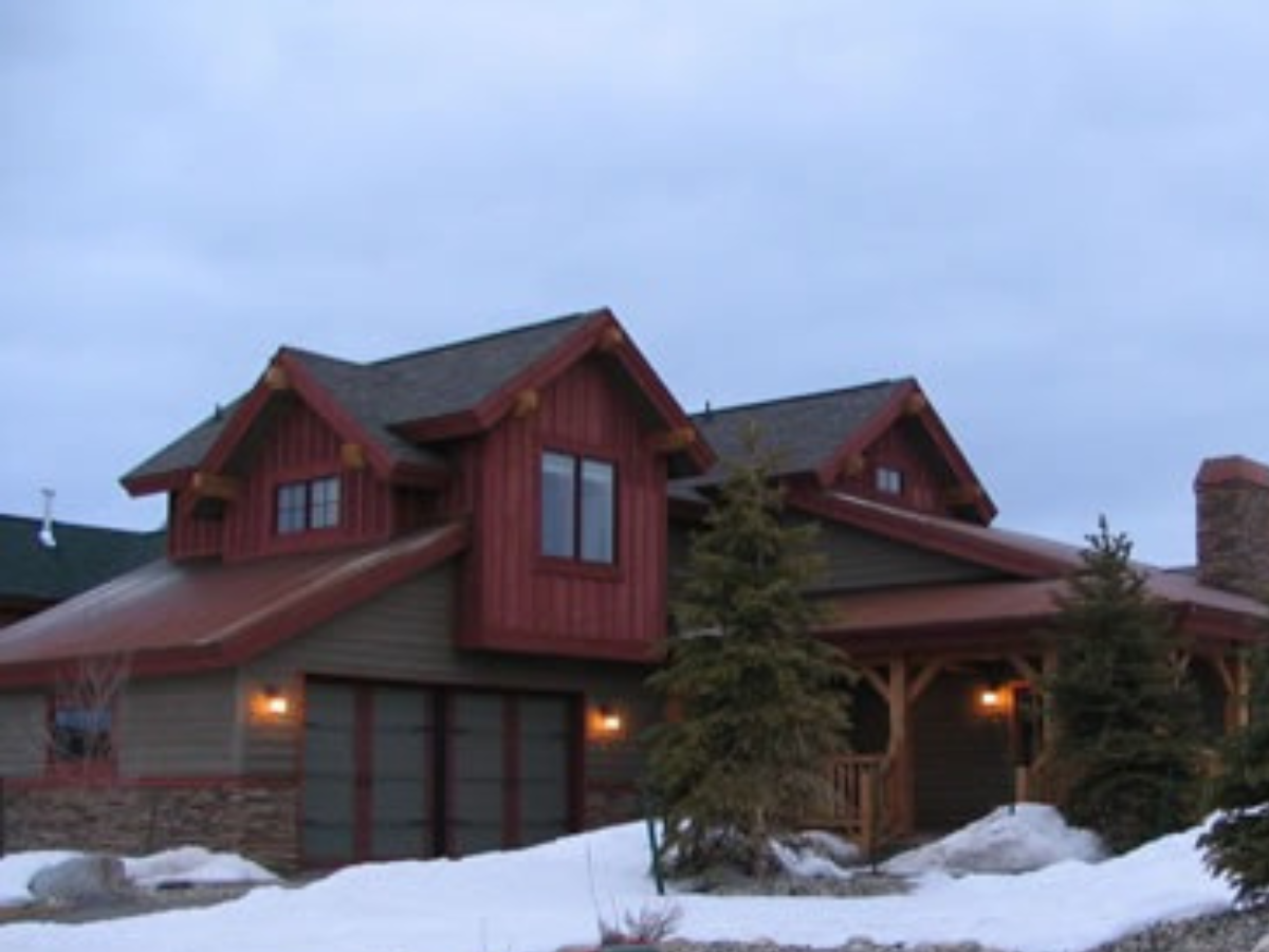 Exterior wood staining and painting project on a custom mountain home featuring rich cedar finishes, rustic timber accents, and durable exterior coatings designed for Colorado mountain climates. Professional painting and staining services for mountai