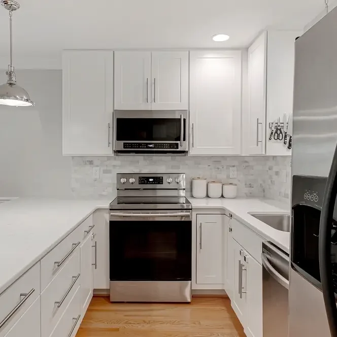 Bright white kitchen cabinets with smooth painted finish and modern updated look in Fort Collins, Colorado