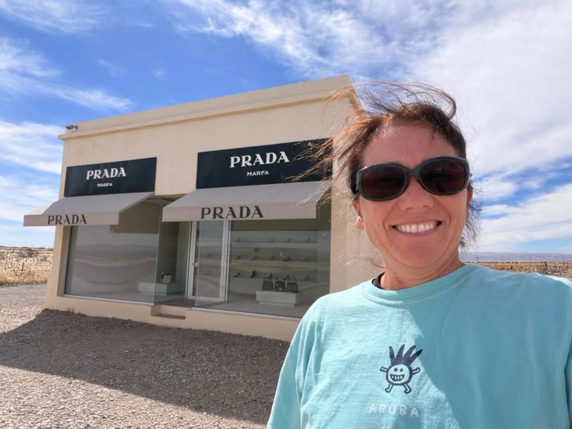 Woman in front of Marfa Prada shop