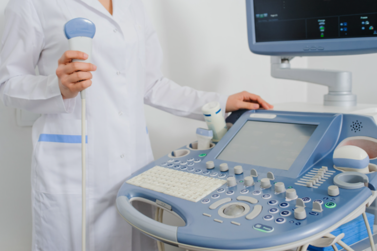 Woman nurse using an ultrasound