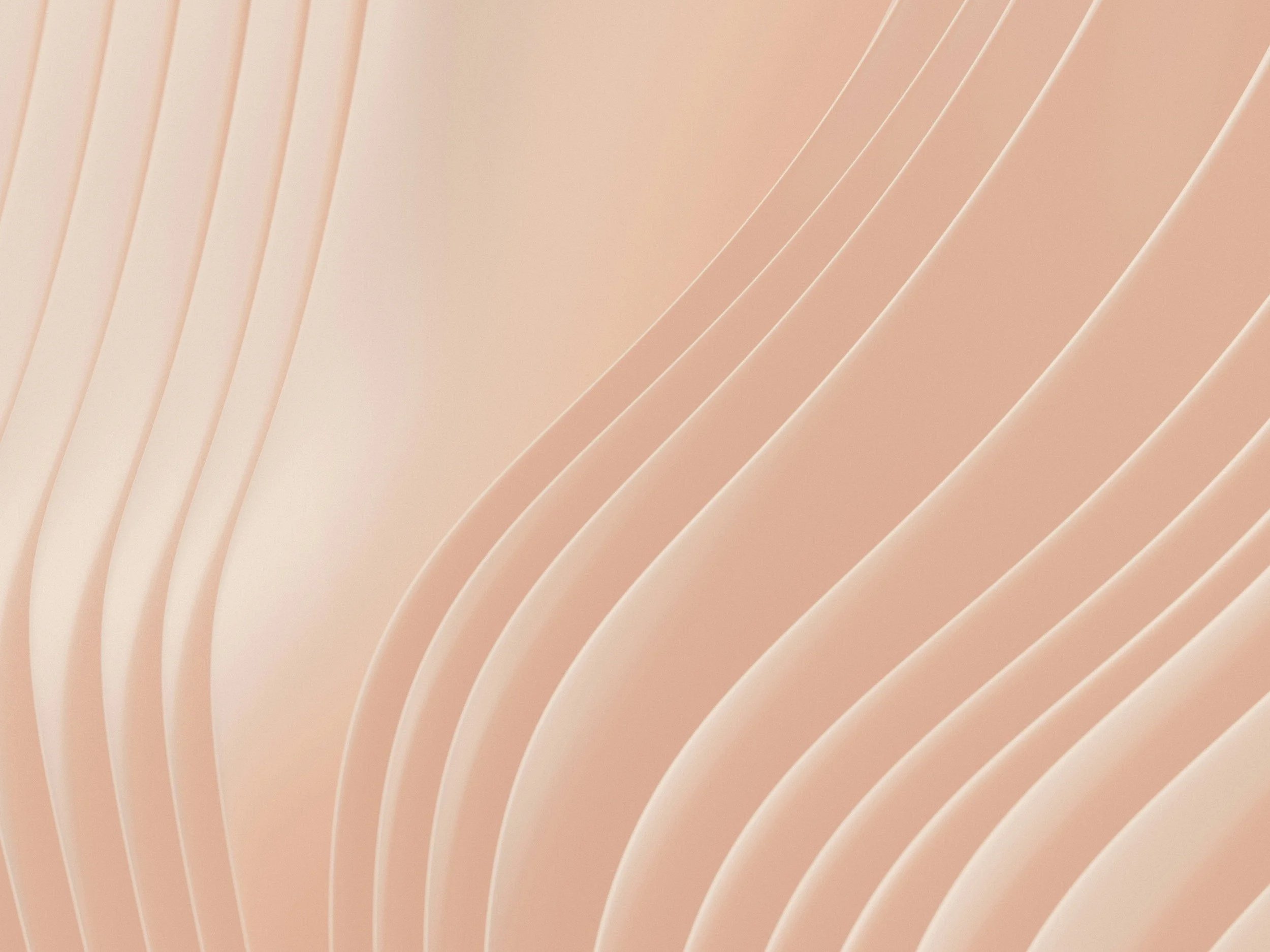 Abstract peach-colored art that looks like wavy lines.