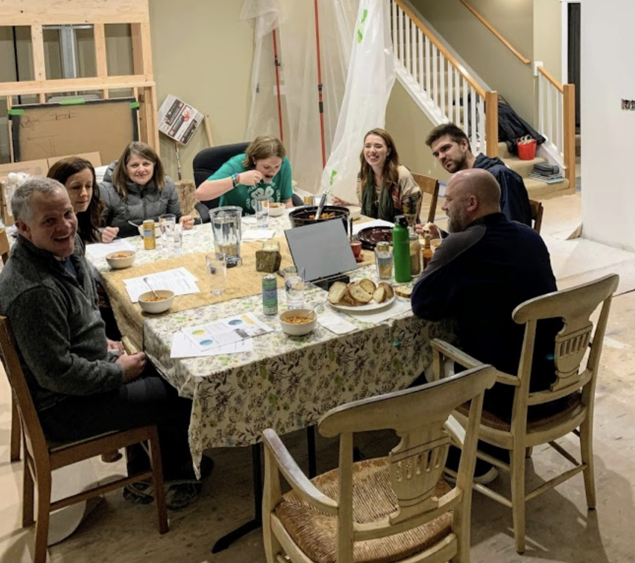 Spring Church leadership team dinner meeting during construction at the McCoy residence