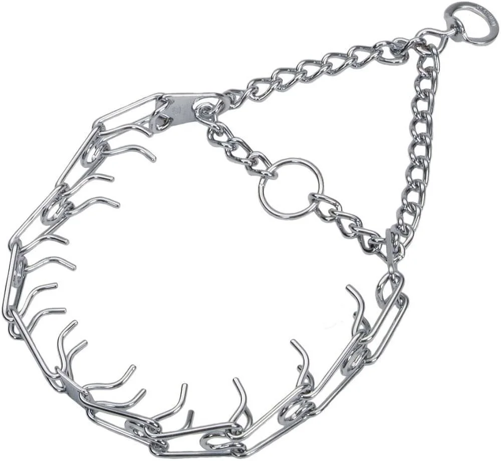 A chain necklace with metal links, hooks, and a large ring, arranged in a loose, irregular shape.