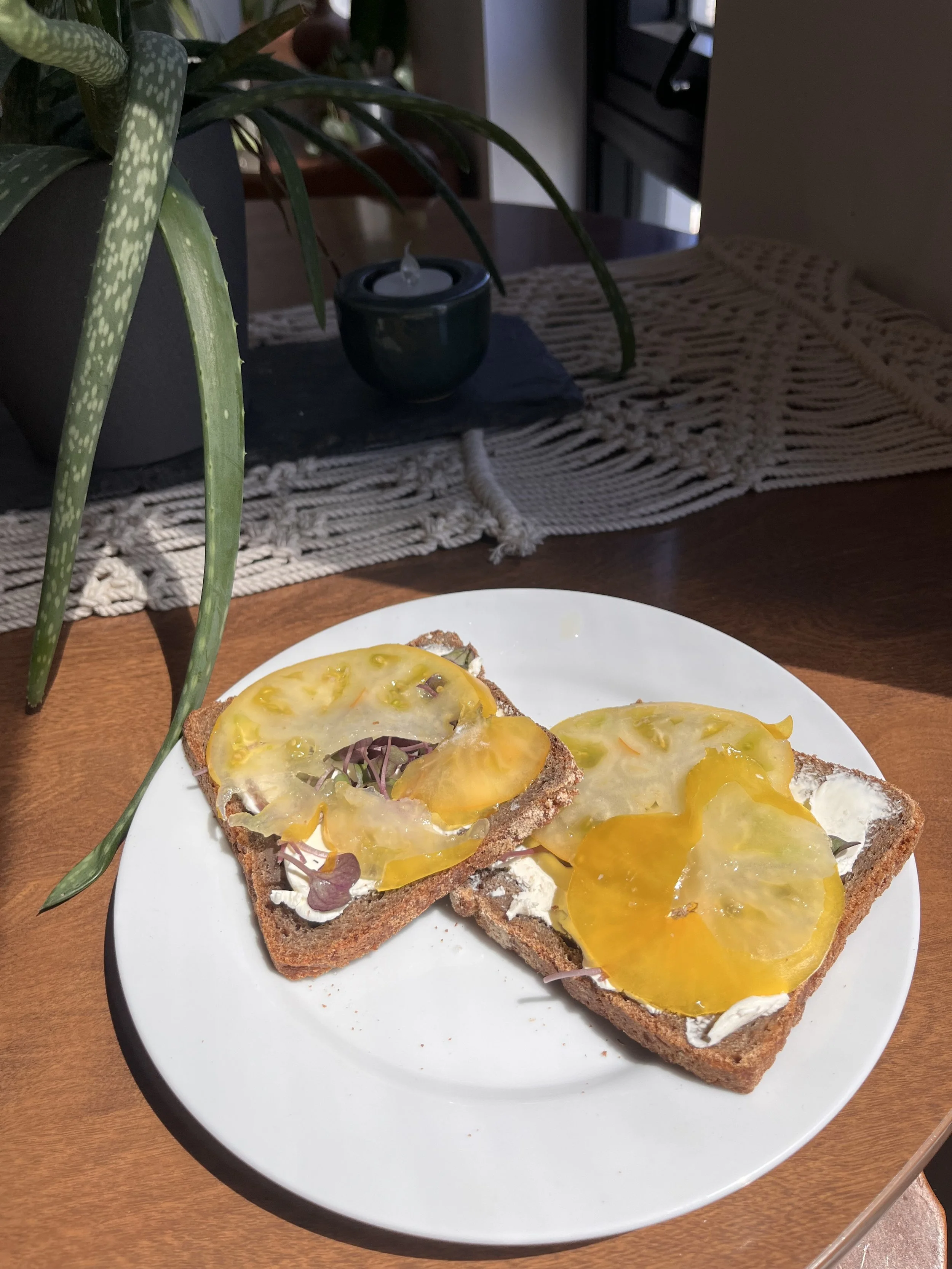rye sourdough cream cheese radish micro greens yellow tomato