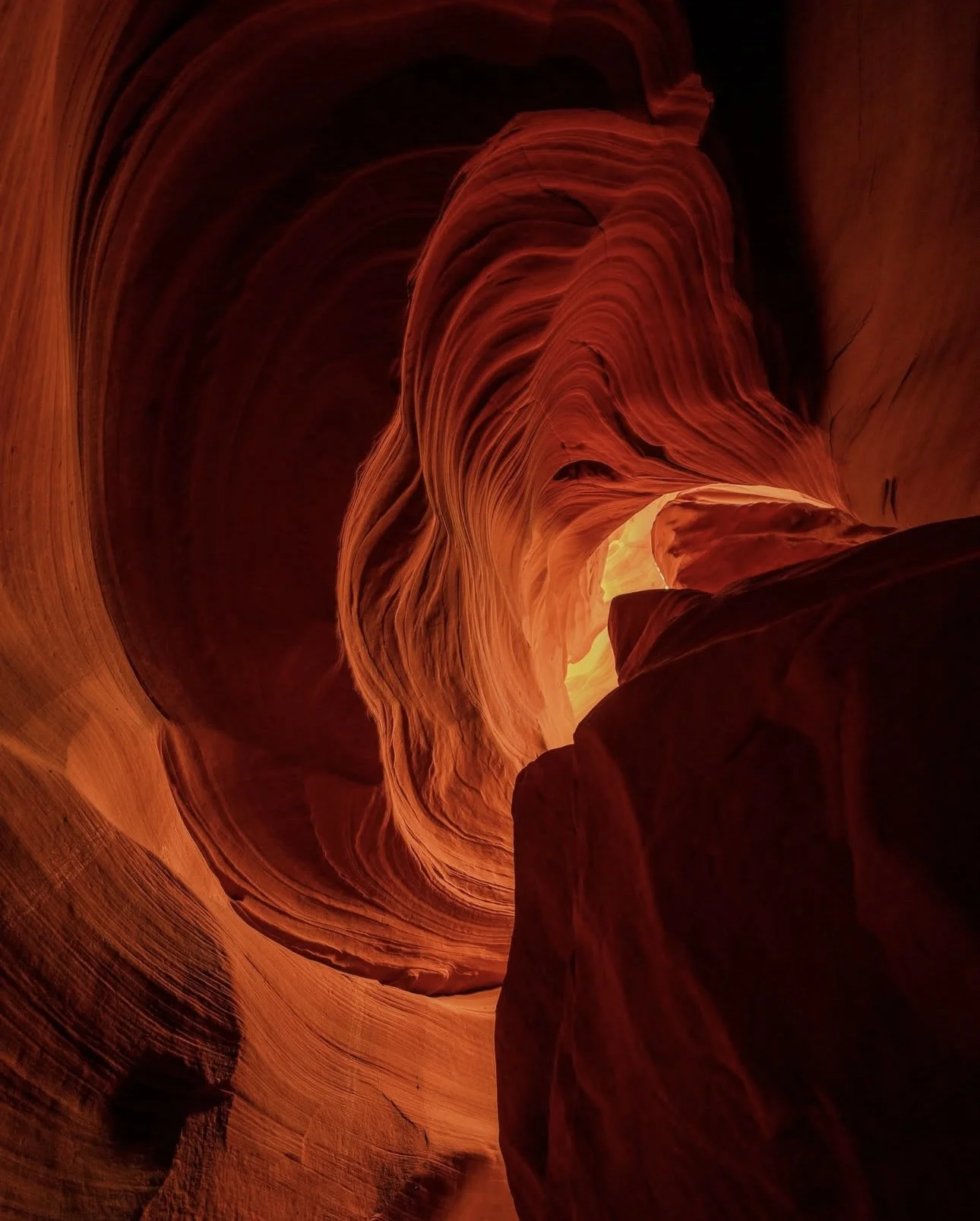 View of Antelope Canyon with swirling orange and red sandstone walls.