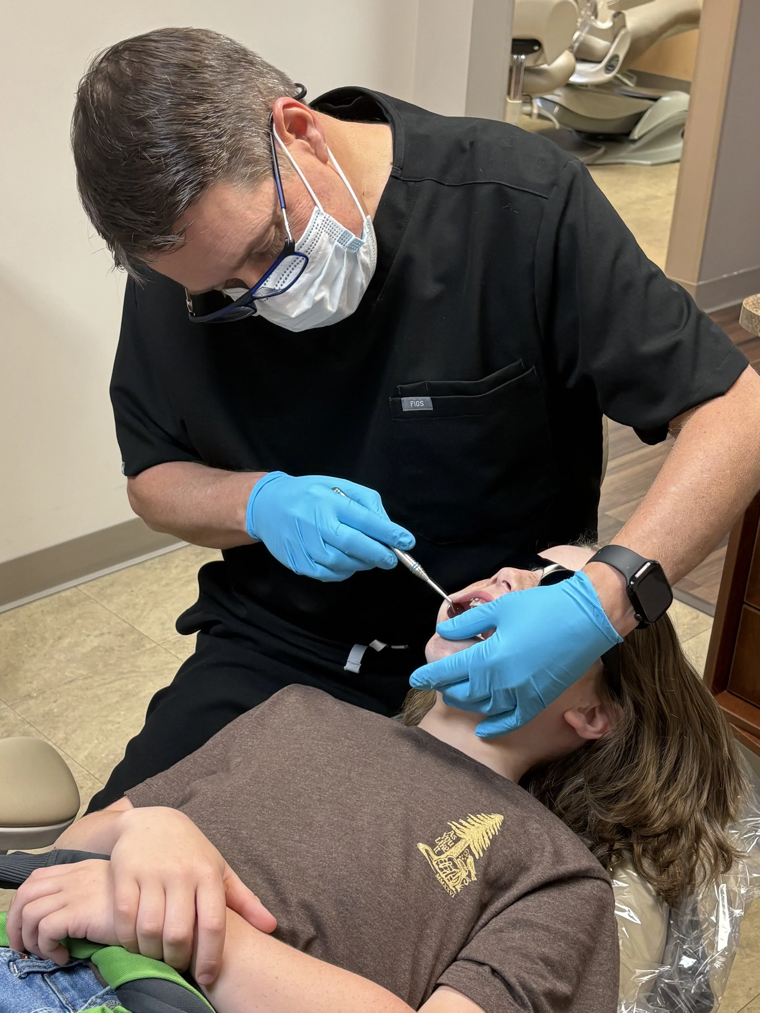 Dr. Ryan Haldeman orthodontist with young patient Upwards Orthodontics Flat Rock NC