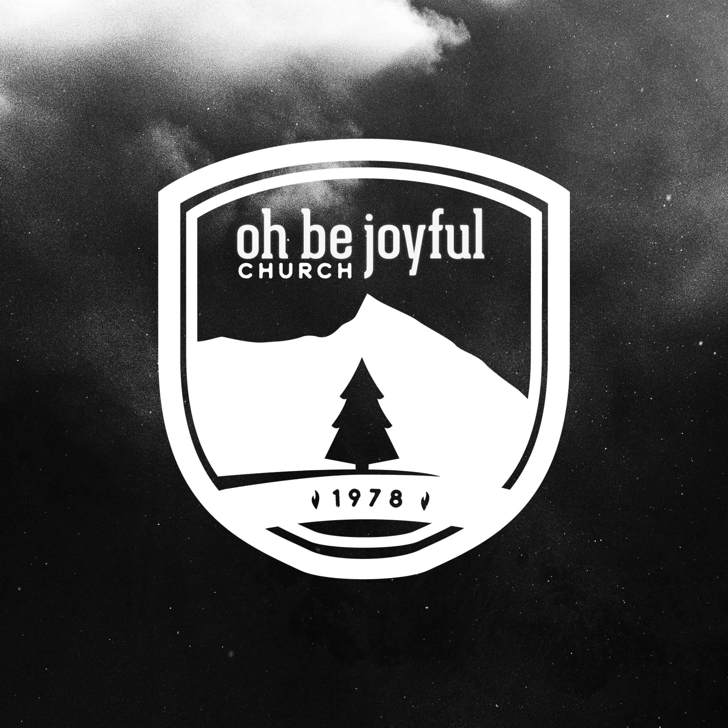 Black and white church logo with a silhouette of a person's head, a tree, and the year 1978, with a star on either side.
