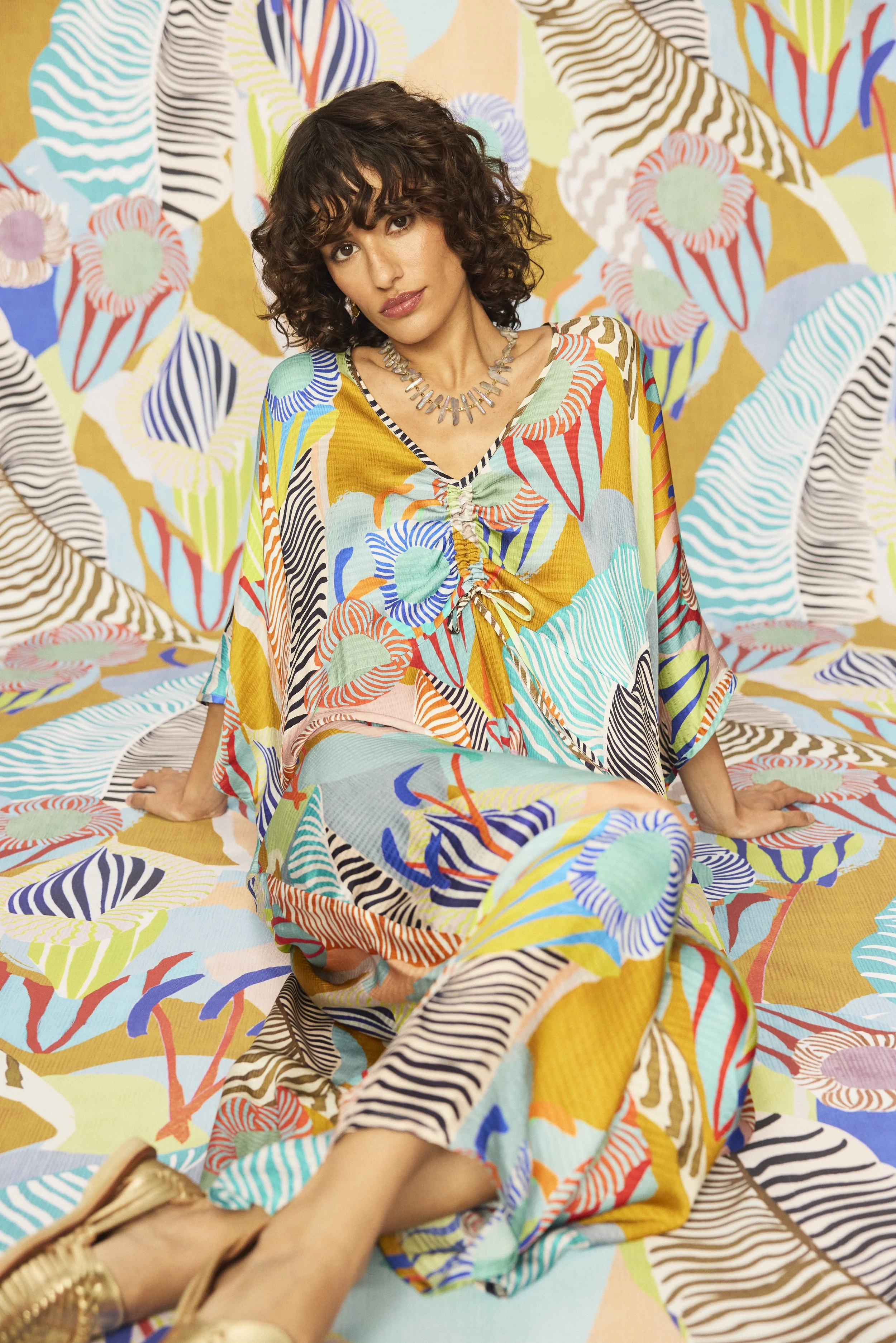 On-set styling and production assistance, High Summer '26 campaign. A maximalist print-on-print editorial where garment and backdrop become one, layered in tropical botanical motifs, and saturated colour.