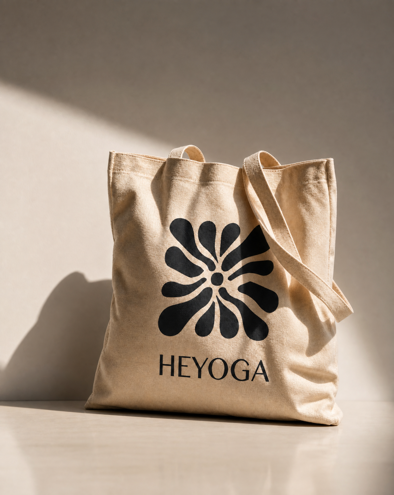 Logo and brand identity for Heyoga: Holly Evans Yoga. Designed to break from the minimal wellness mould while staying rooted in organic movement. The petal mark reads as both a flower and a body in motion, bold enough to brand, considered enough to l