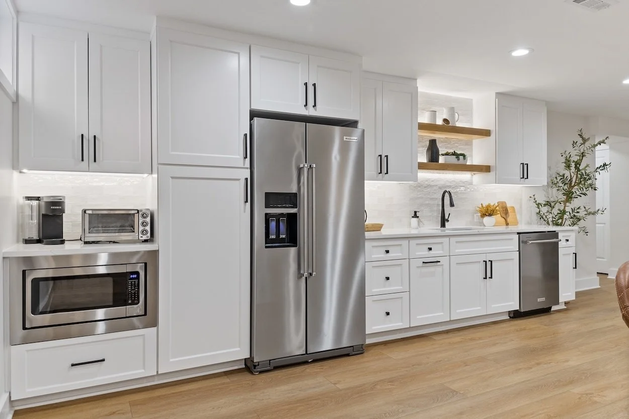Basement kitchenette with coffee maker, toaster over and microwave.jpg