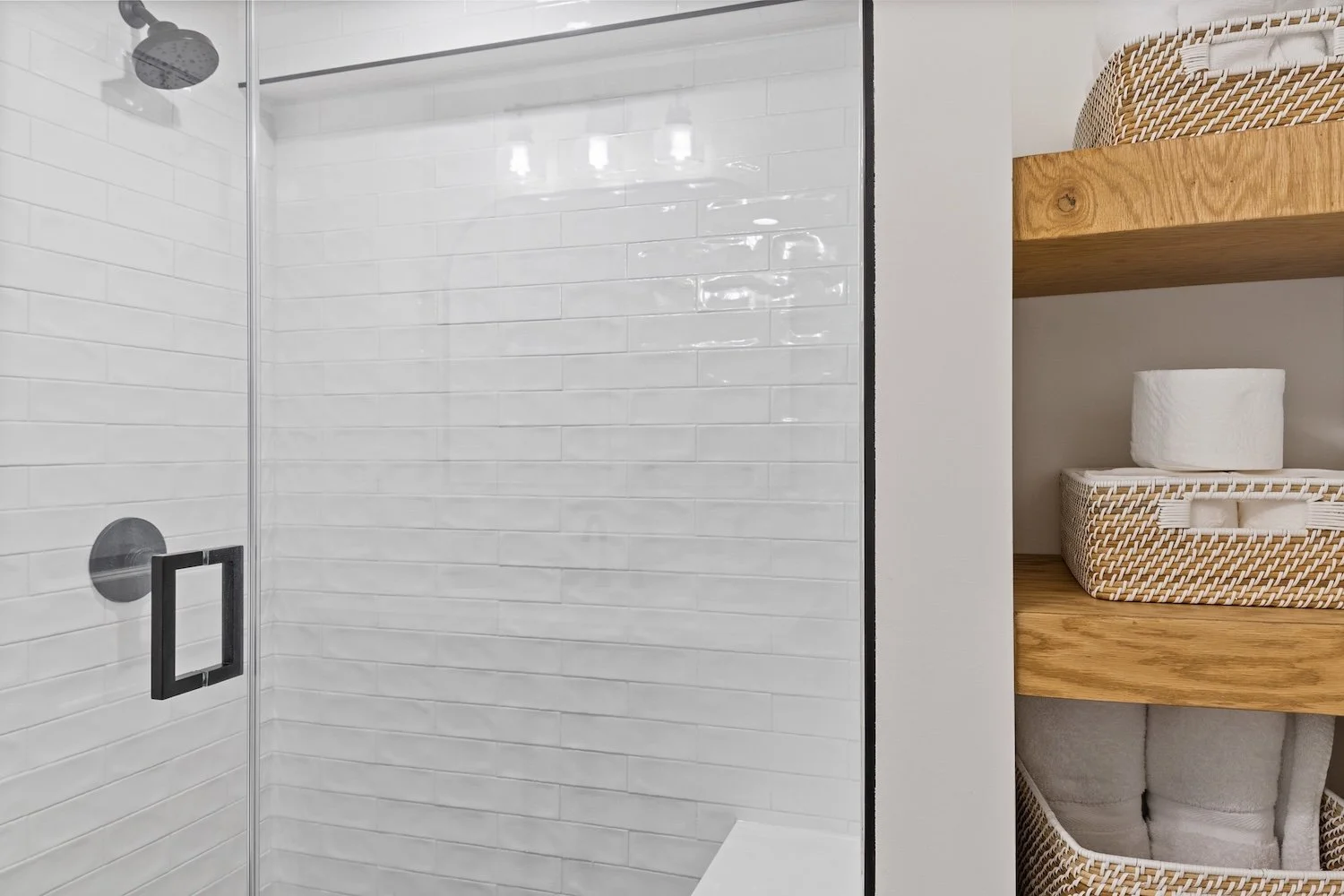 New basement bathroom with walk in shower and storage.jpg