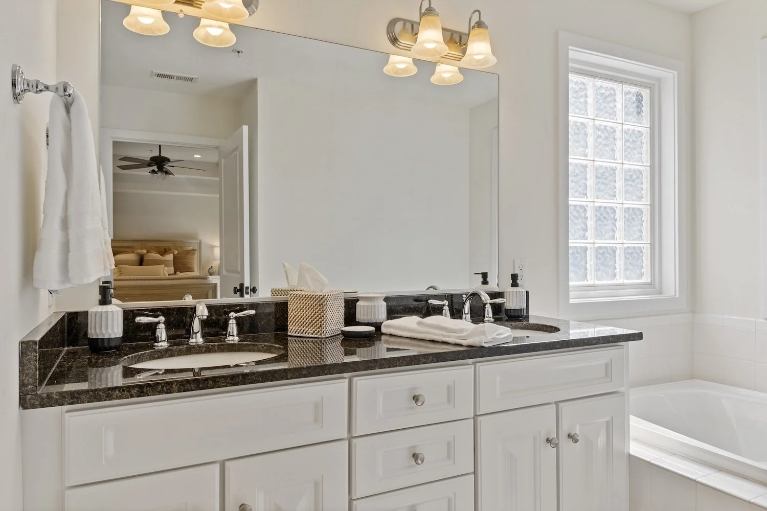 Primary ensuite bathroom with double sinks (1).jpg