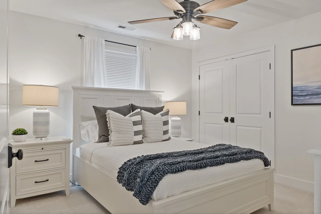 Guest bedroom with queen bed and TV.jpg