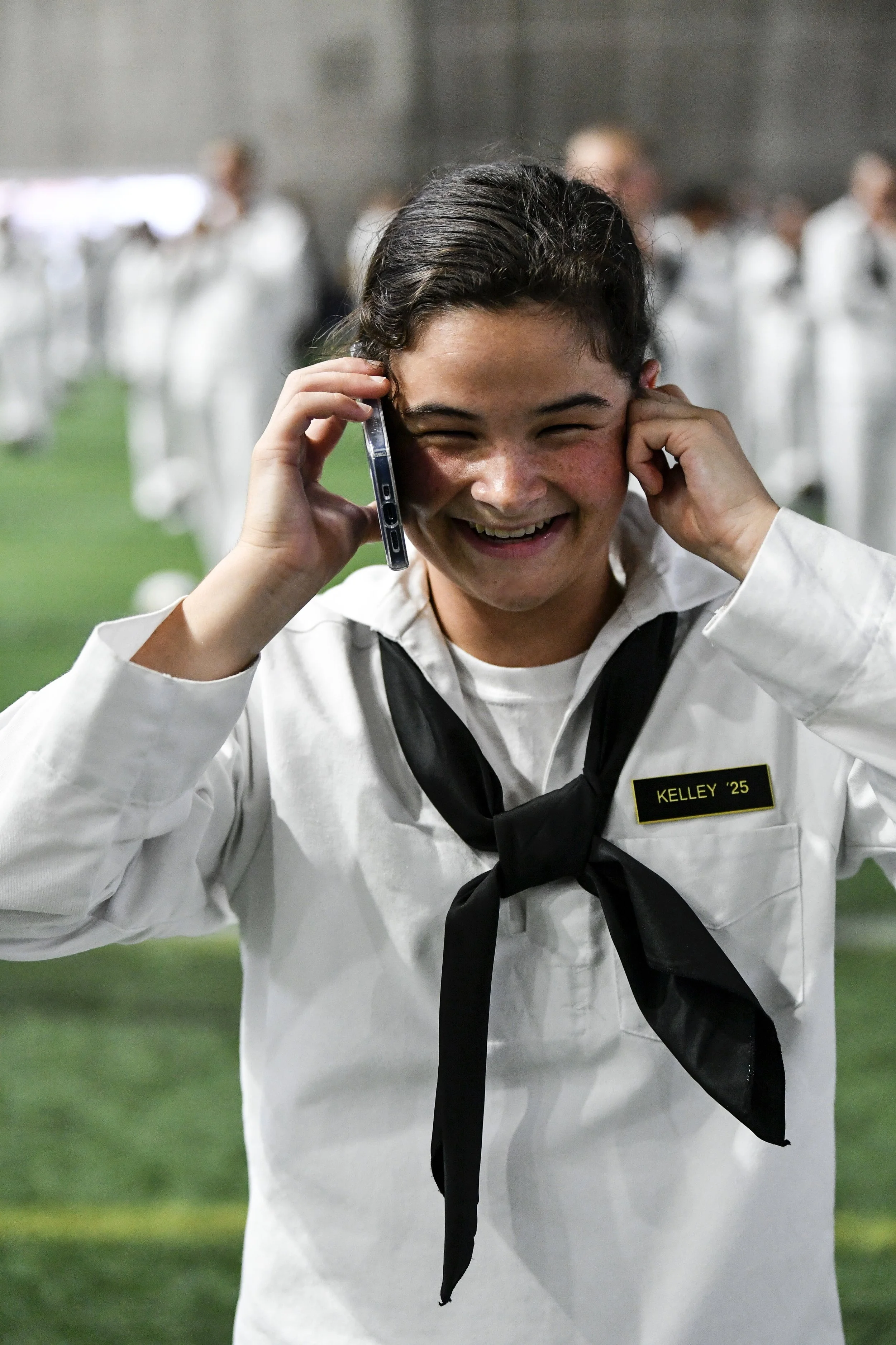 Kim's daughter, a pleb, making a phone call in uniform
