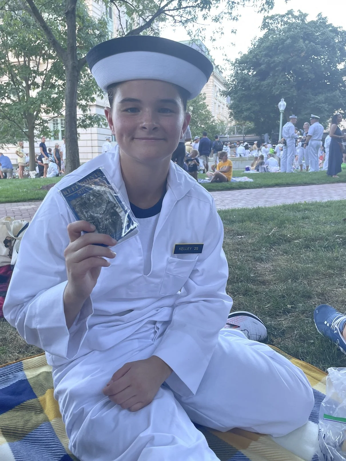 A pleb holding up her Reef Points handbook
