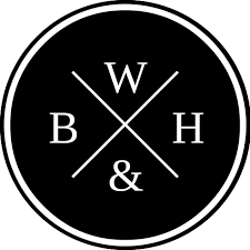 Black circular logo with white letters: W, B, H, and & arranged around a central cross.