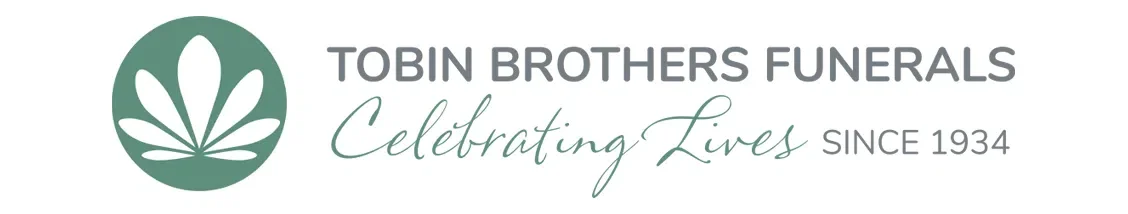 Logo for Tobin Brothers Funerals featuring a stylized white flower inside a green circle, with text that says 'Tobin Brothers Funerals Celebrating Lives Since 1934'.