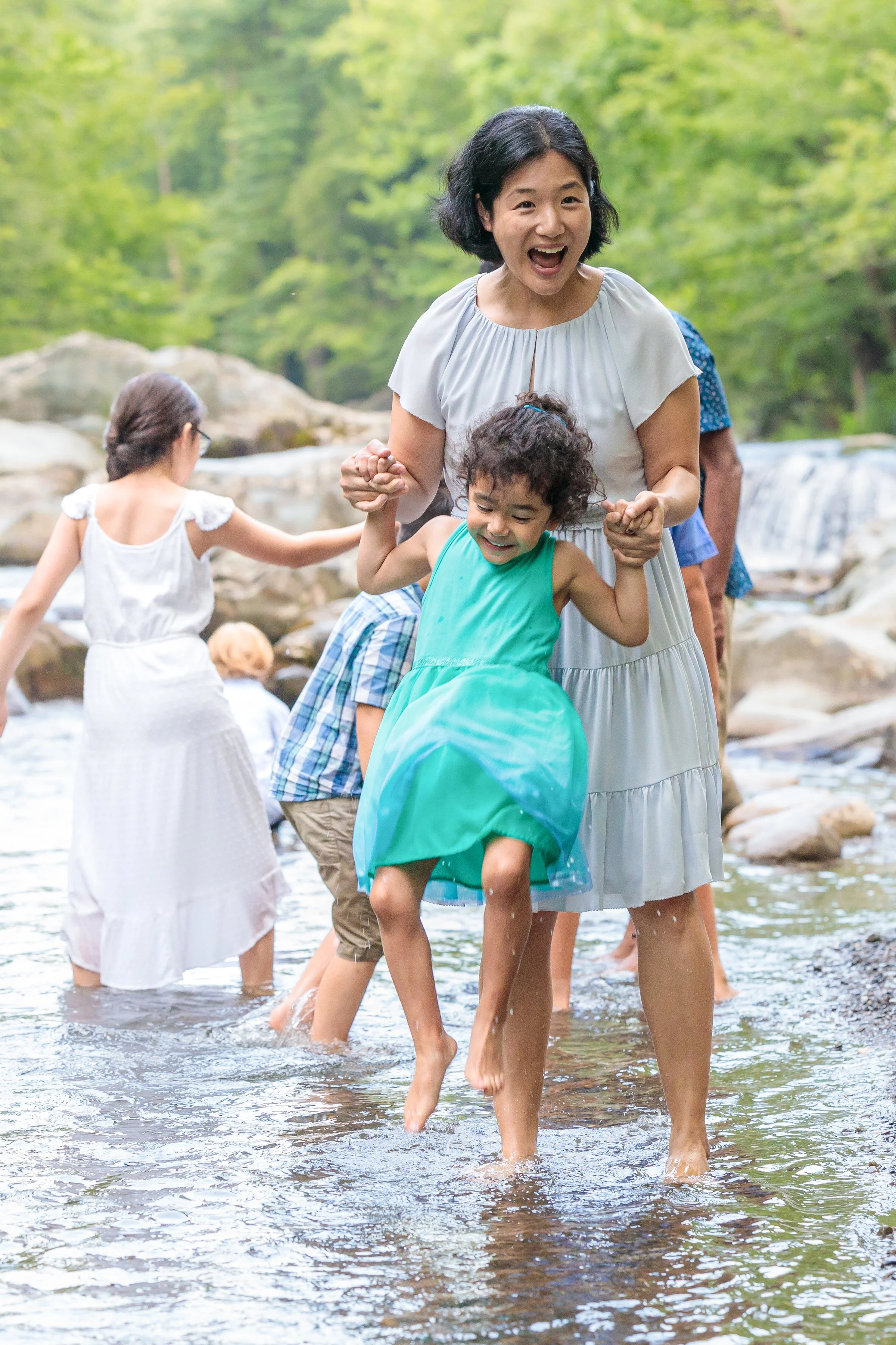 A mother plays with her child in a candid photo taken in the Great Smoky Mountains Naitonal Park
