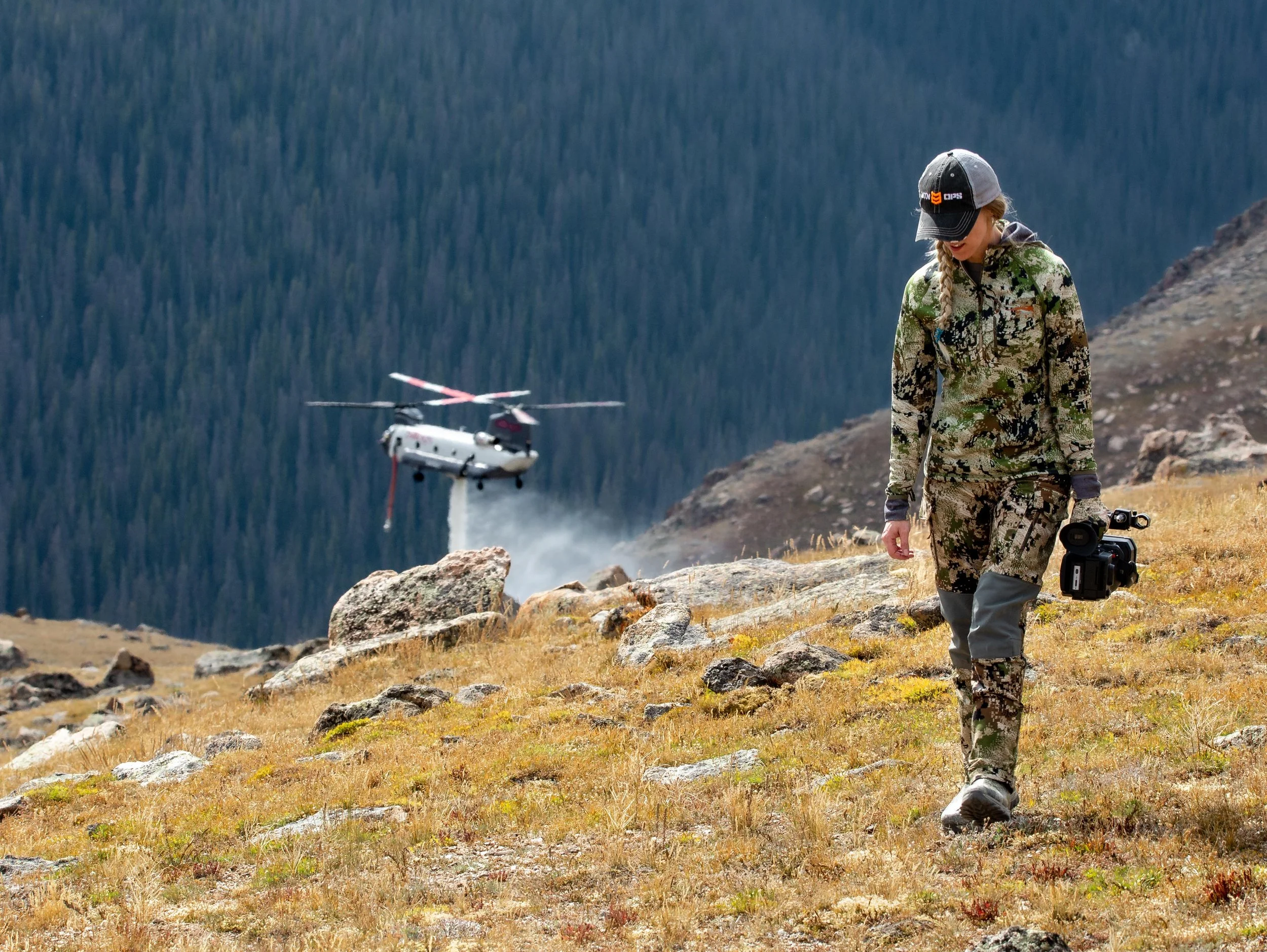 Alli getting video of a chinook helicopter putting out a fire in RMNP 