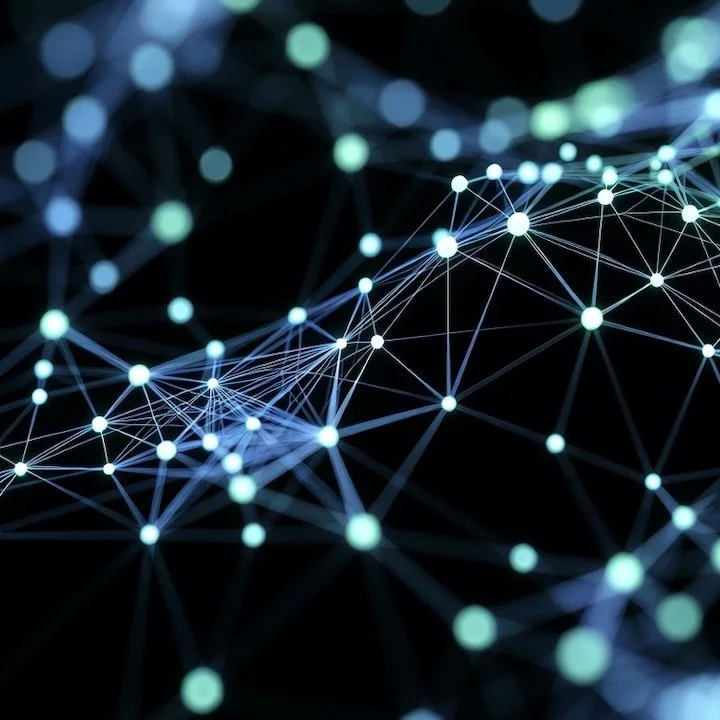 Abstract digital network with interconnected glowing points and lines on a dark background.
