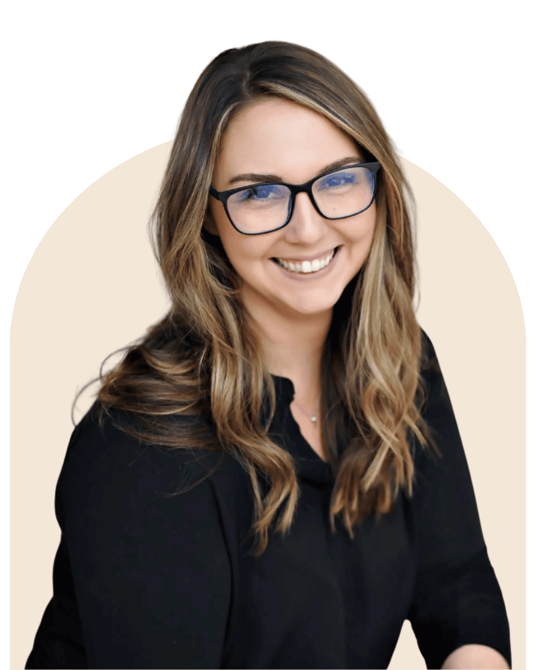 Jenna Johnson, owner of Avenue 530 Realty, smiling with glasses, long wavy hair, wearing a black shirt, against a beige background.