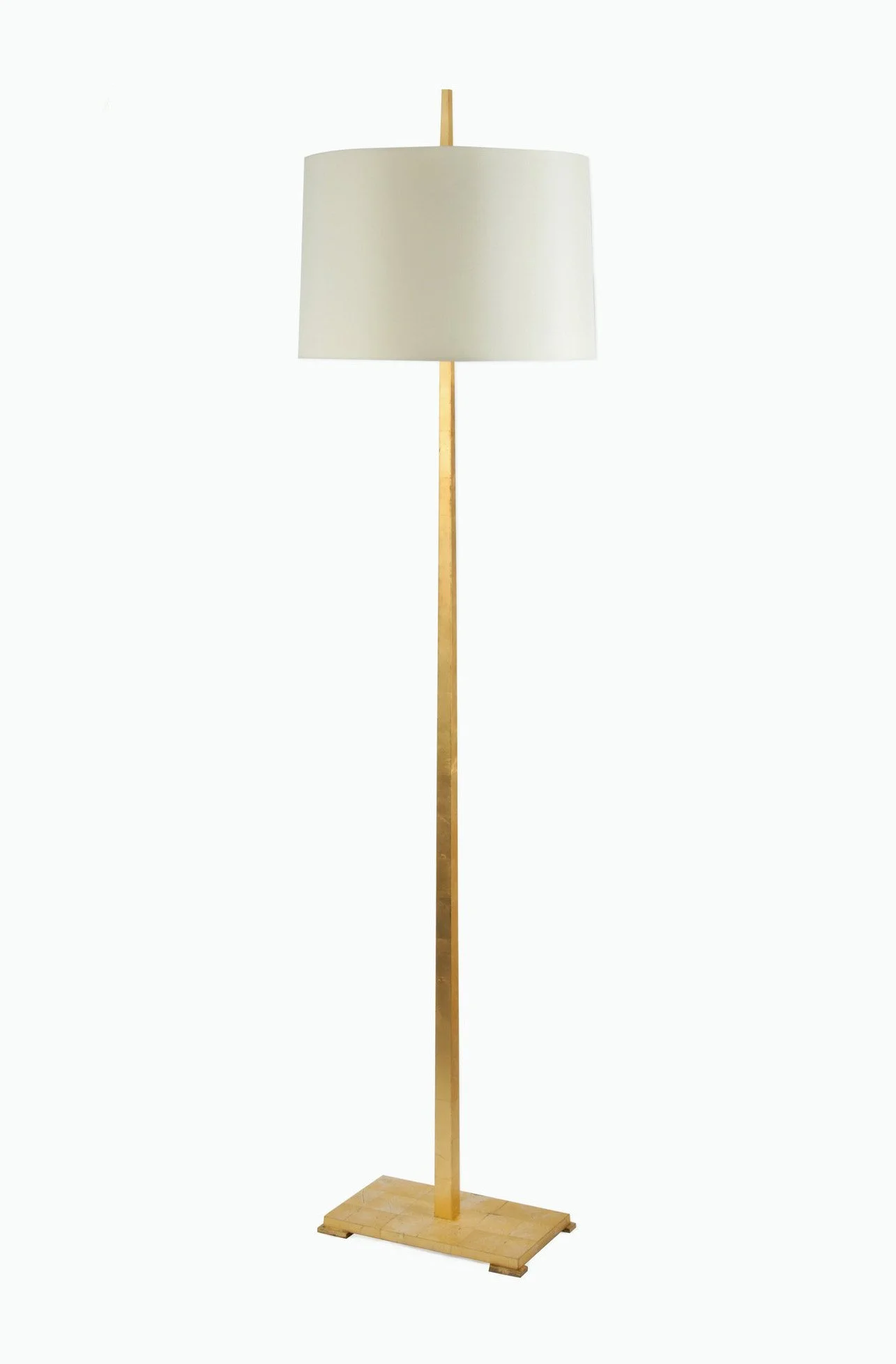 A floor lamp with a white drum shade, a long wooden pole, and a wooden base.
