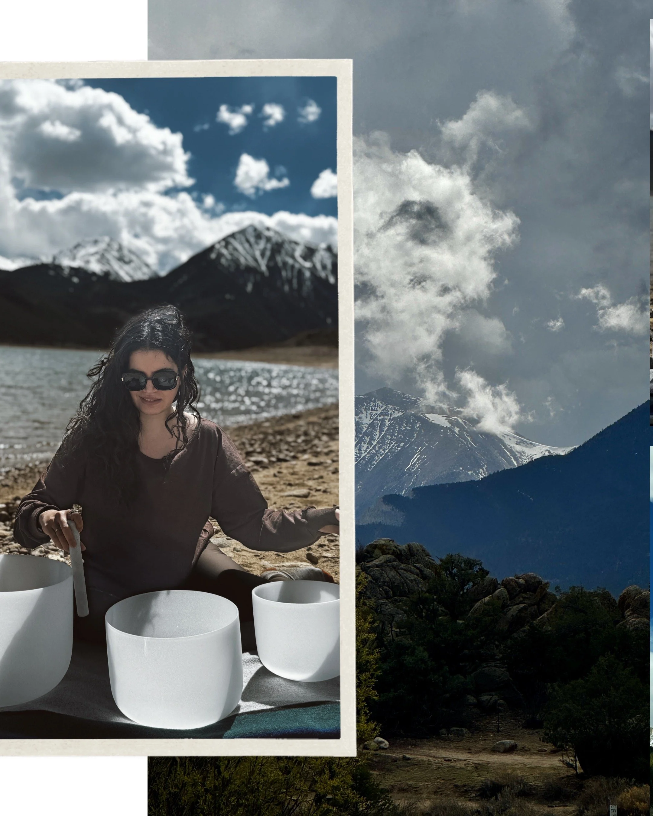 A woman with curly hair and sunglasses sitting at a table outdoors, with snow-capped mountains and a lake in the background, and a larger mountain and cloudy sky