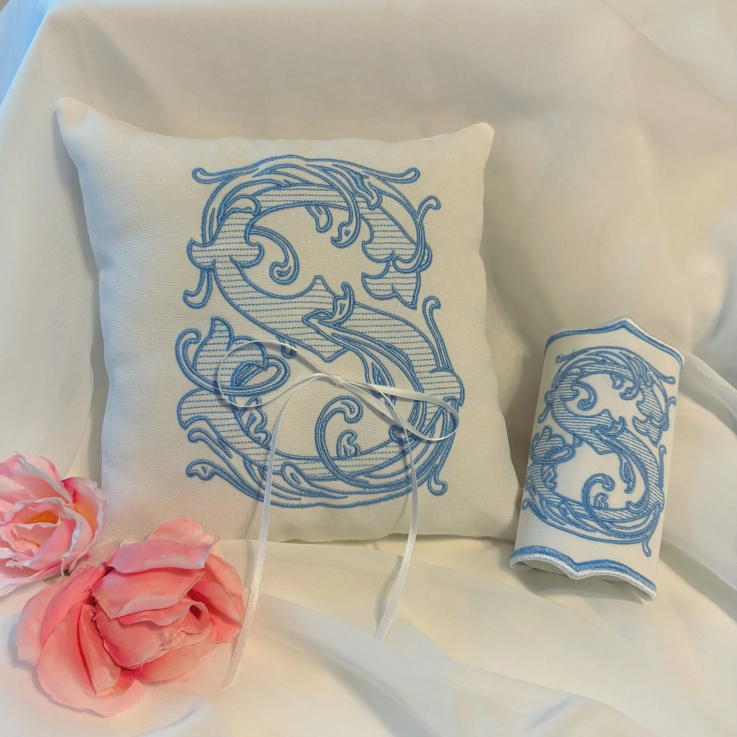 Your wedding details deserve to be just as meaningful as the big moments ✨ Our custom embroidered ring pillow and matching bouquet wrap feature the couple&rsquo;s monogram stitched in a beautiful bridal blue. It&rsquo;s the perfect way to add your &l