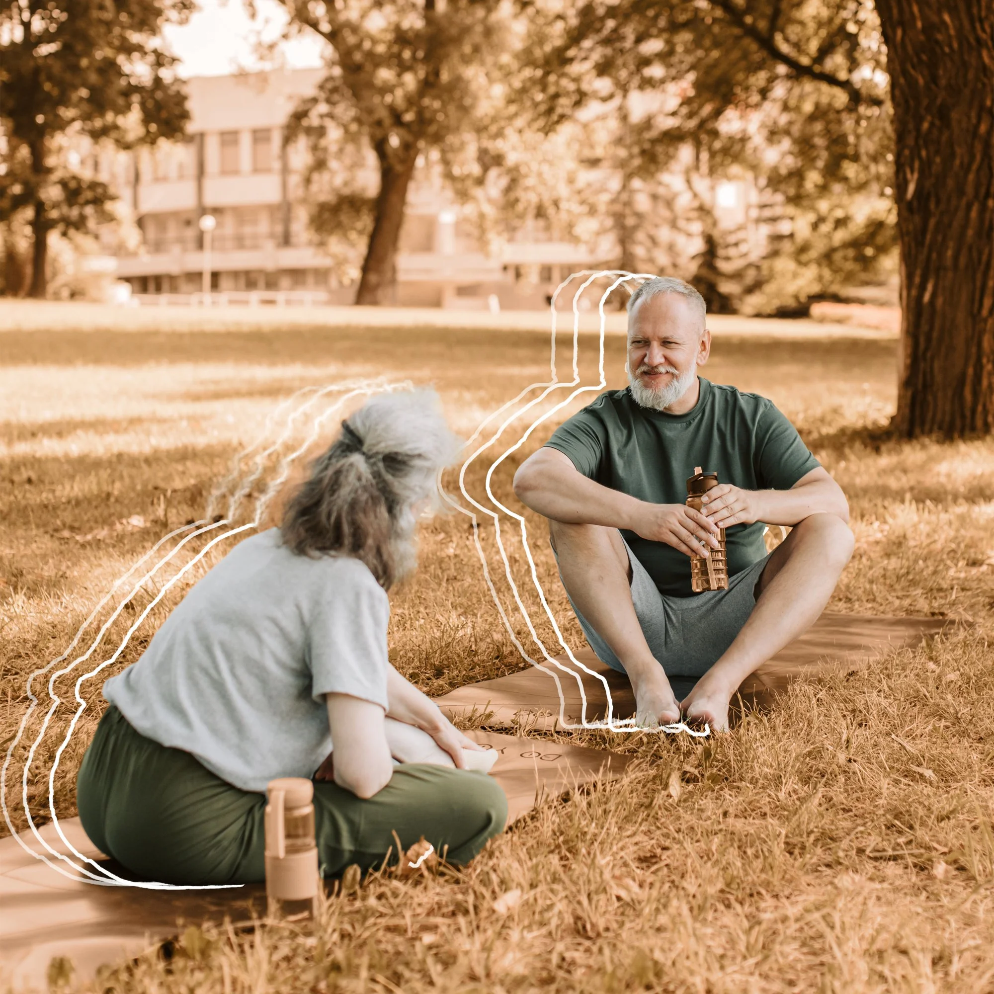 Healthy older couple yoga park