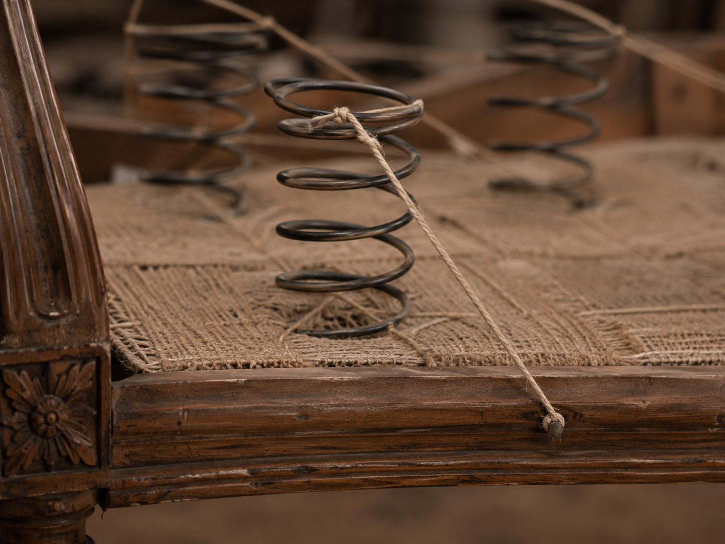 spring in a old chair RESTORIUM
Hand-tied springs exposed inside an antique chair during upholstery restoration