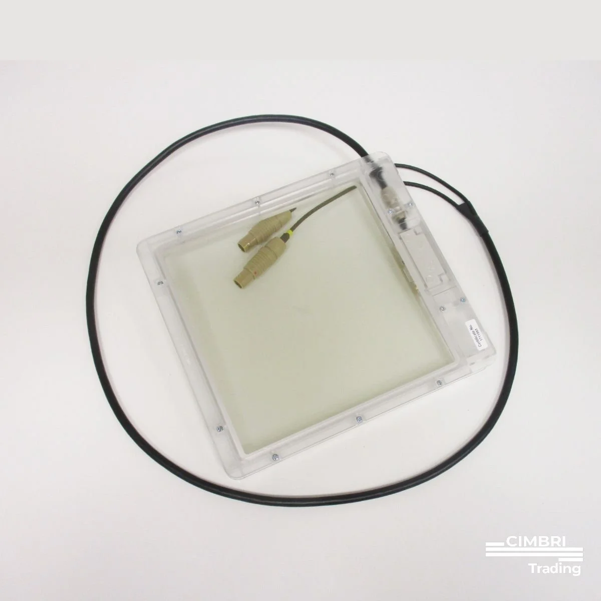 A clear plastic device with two attached wires and connectors, placed on a white surface.