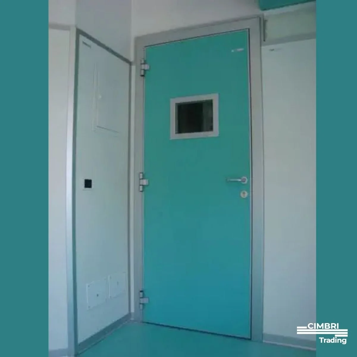 Hospital or clinical room with teal door featuring a small rectangular window, adjacent white wall with electrical panel.