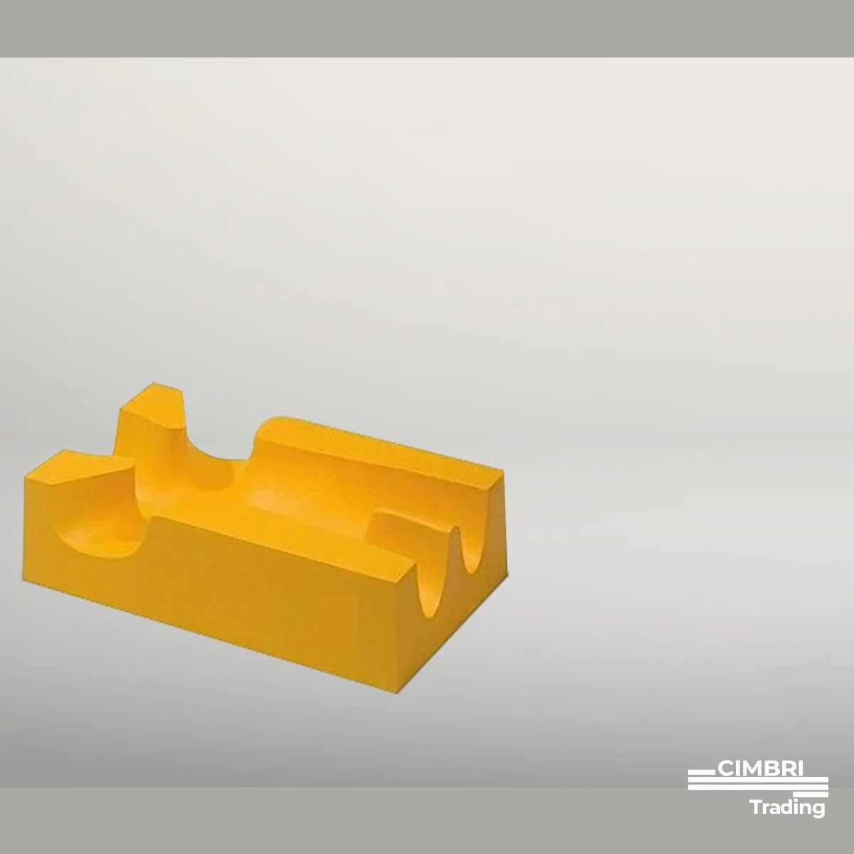 Yellow plastic puzzle piece with various cutouts, set against a plain white background.