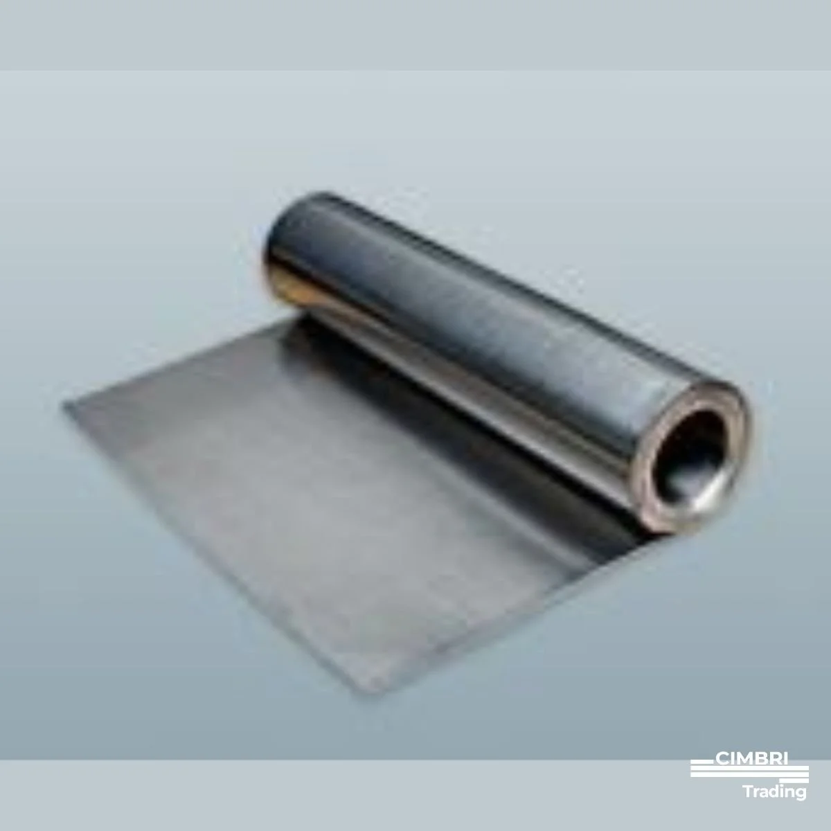 Metal roller with a piece of metal sheet underneath it on a light surface.