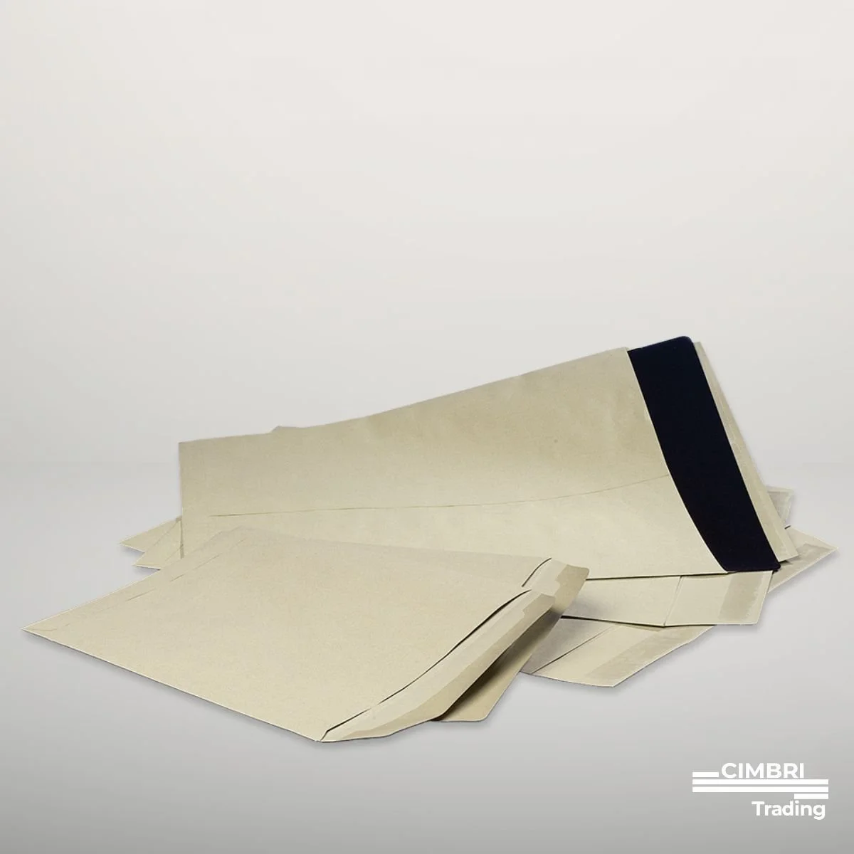 A stack of cream-colored paper or manila envelopes with a black band, placed on a plain light surface with a white background, with a small logo of Cimbri Trading in the bottom right corner.