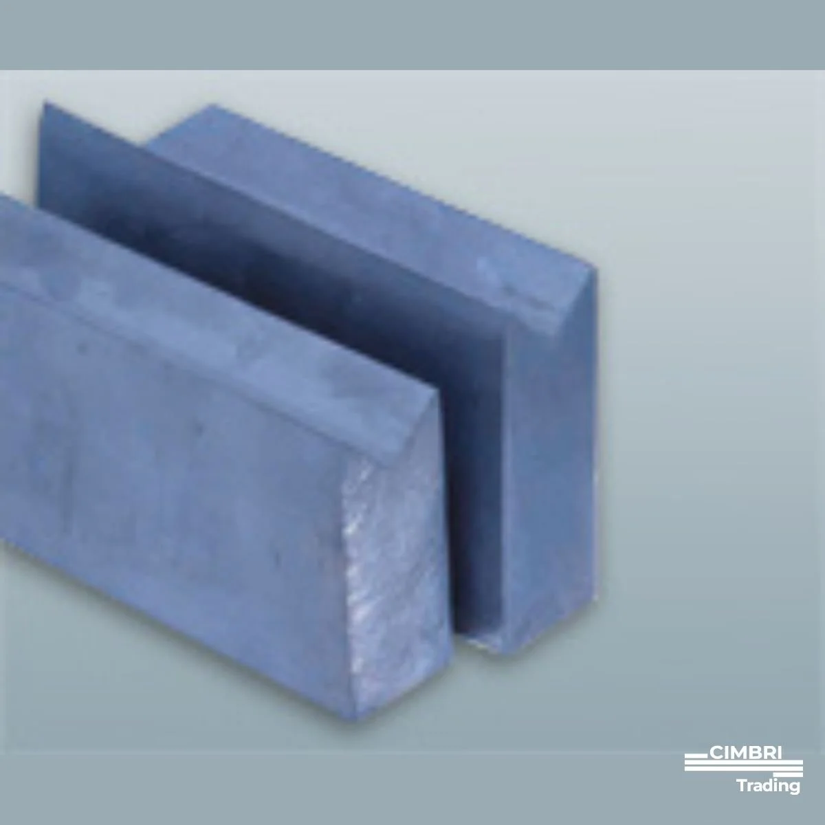 Close-up of two large, rectangular metal blocks with a corner cutout, made of a bluish-gray metal, placed on a light background with a logo that says 'CIMBRI Trading' in the bottom right corner.