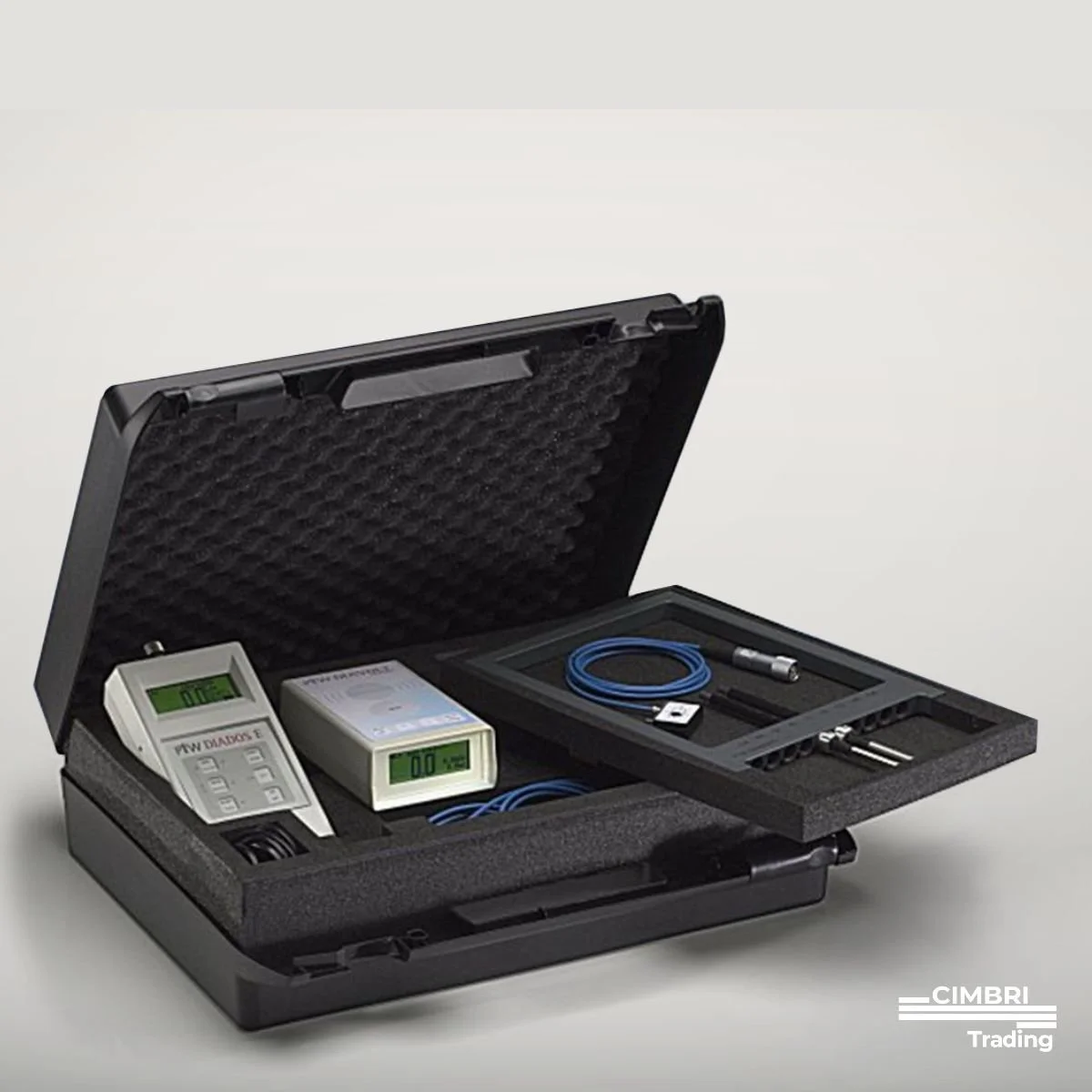 A black carrying case containing electronic testing equipment, including a digital multimeter and various probes and cables.