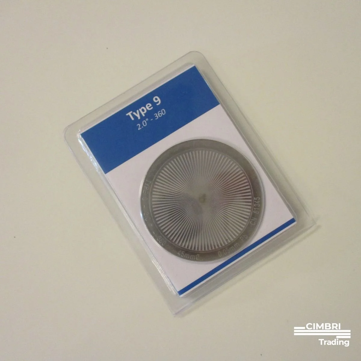 A sealed case containing a metal watch bezel with a radial pattern, labeled "Type 9, 2.0° - 360" on a white and blue background.