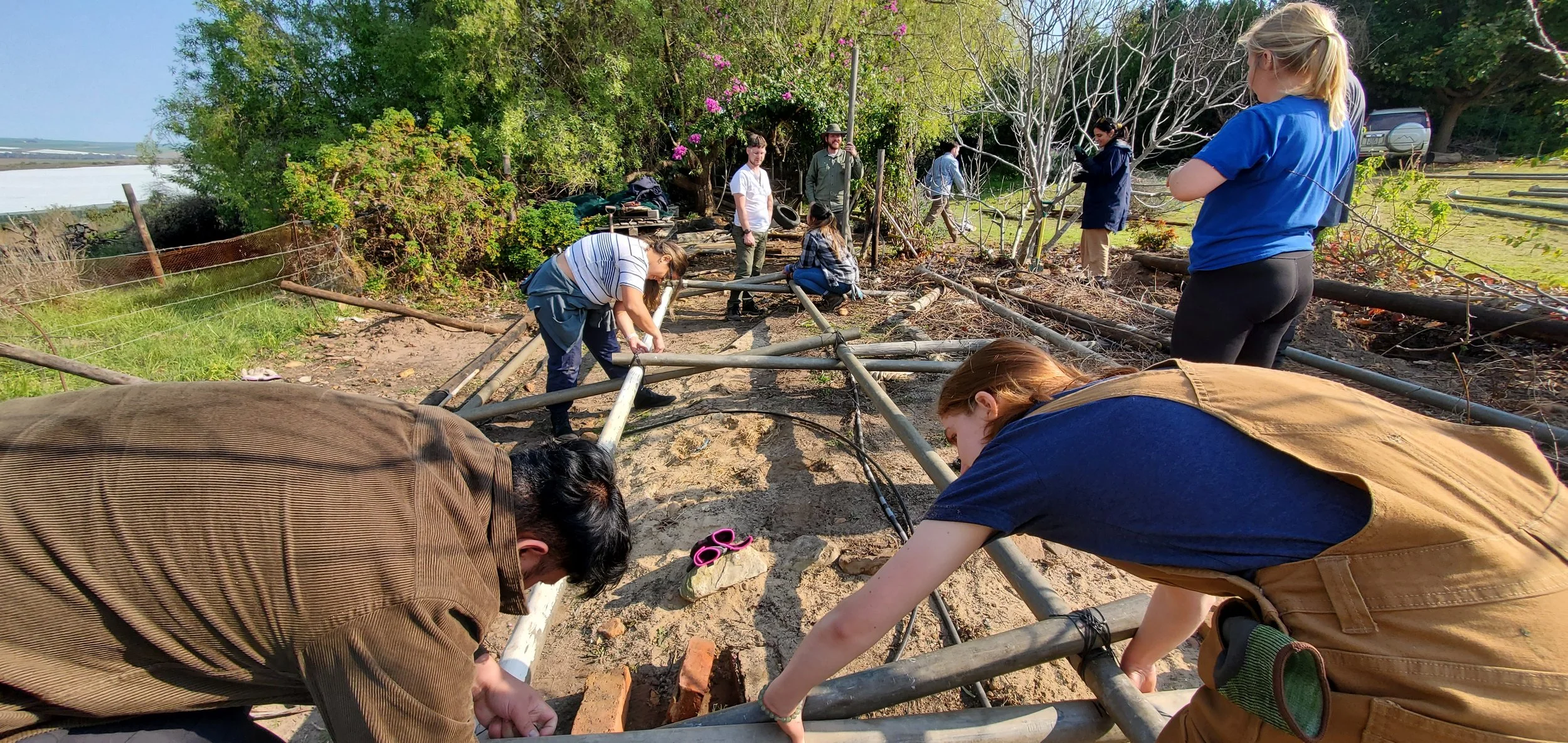 Students working on reclaimed treehouse project