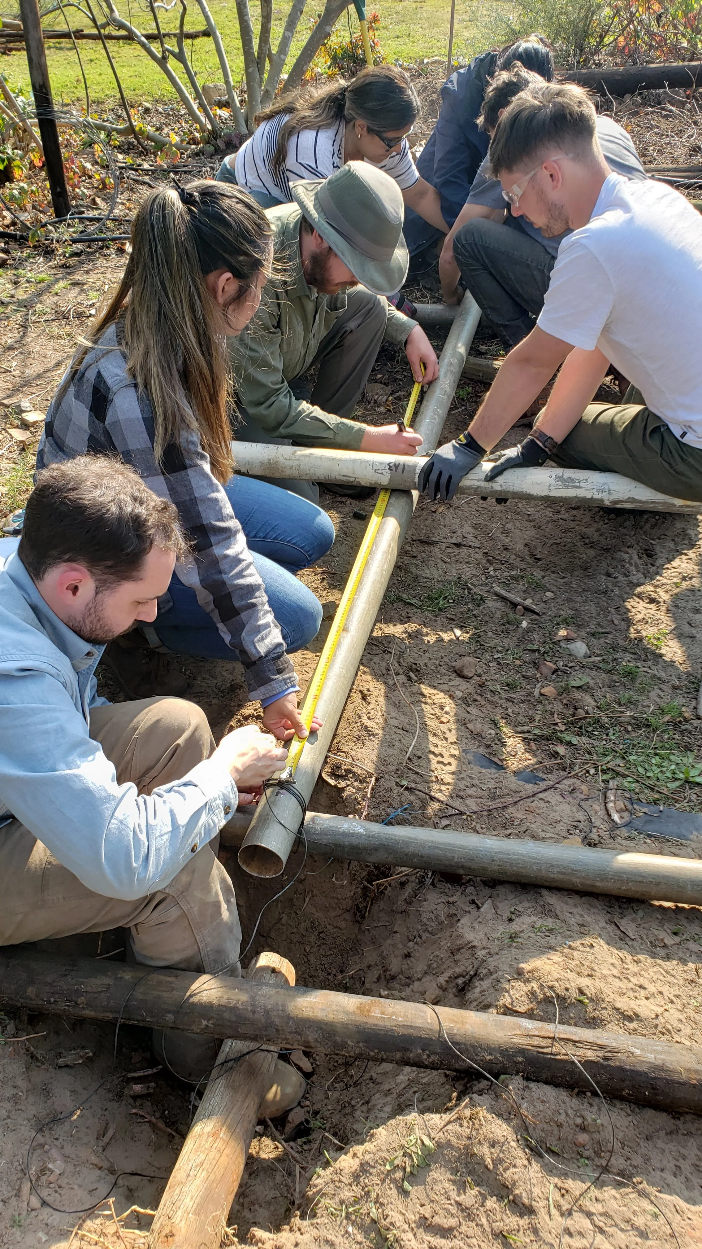 students working on reclaimed greenhouse project
