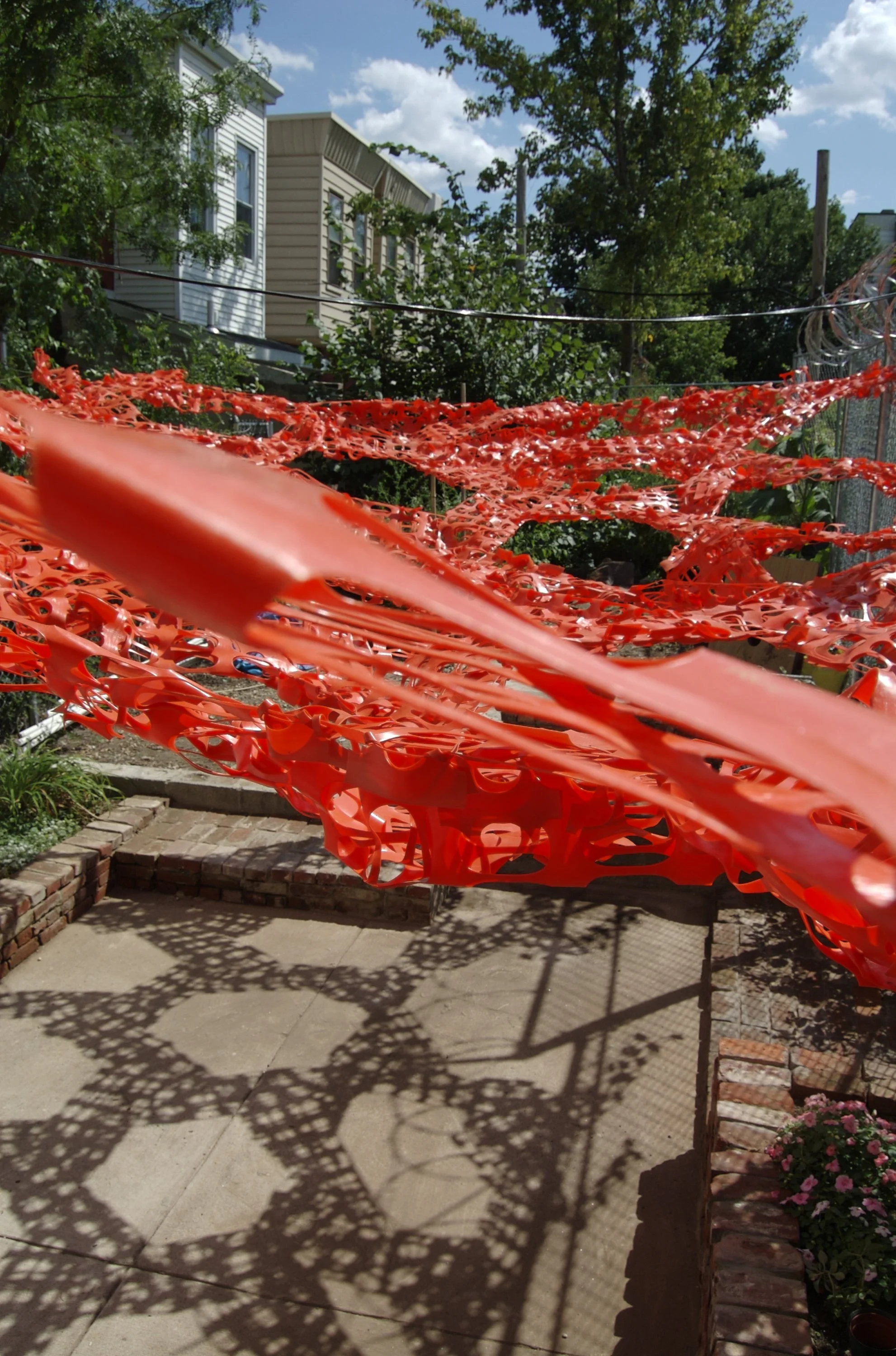 Red fence creating shade outdoors