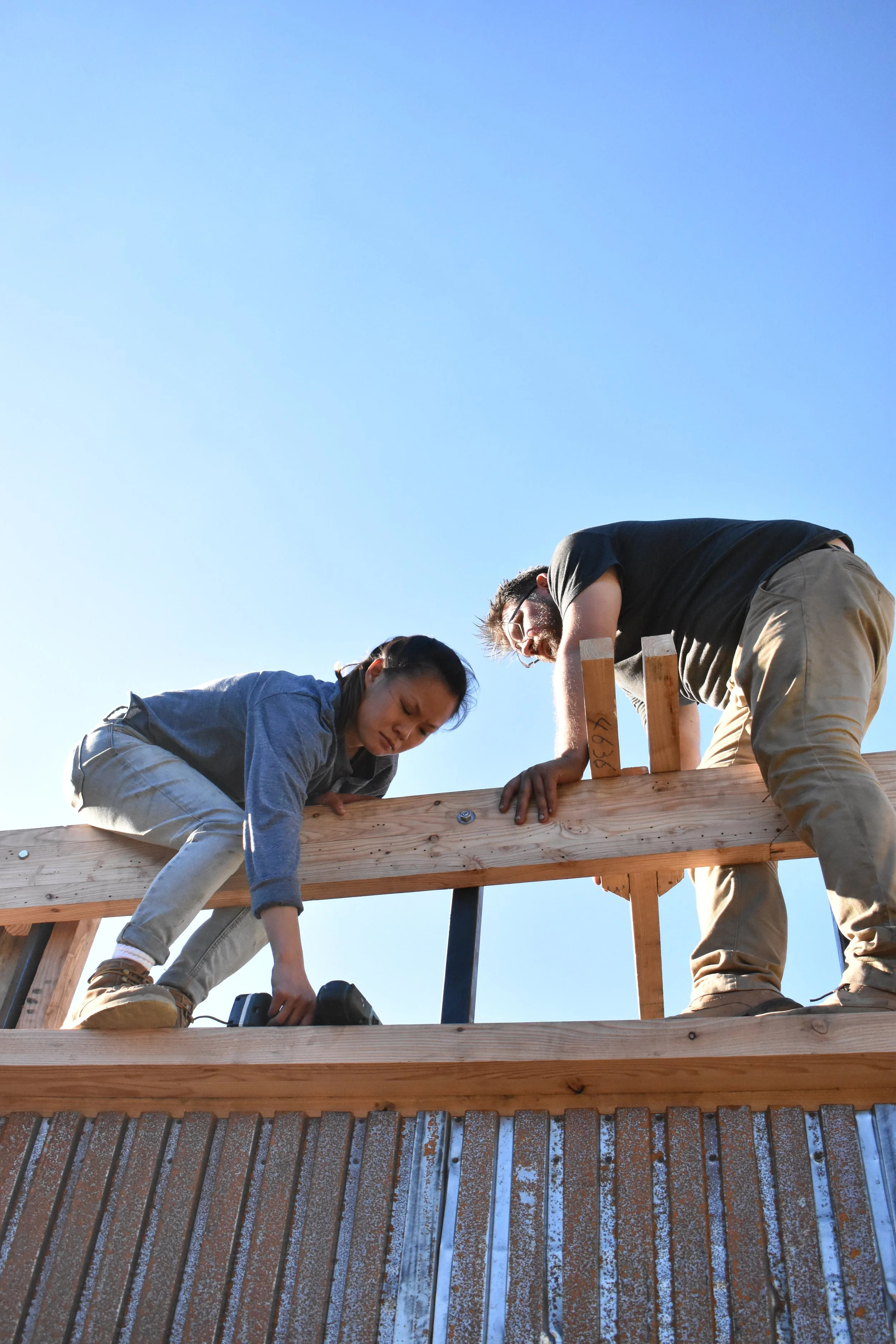 volunteer workers working on maker space project