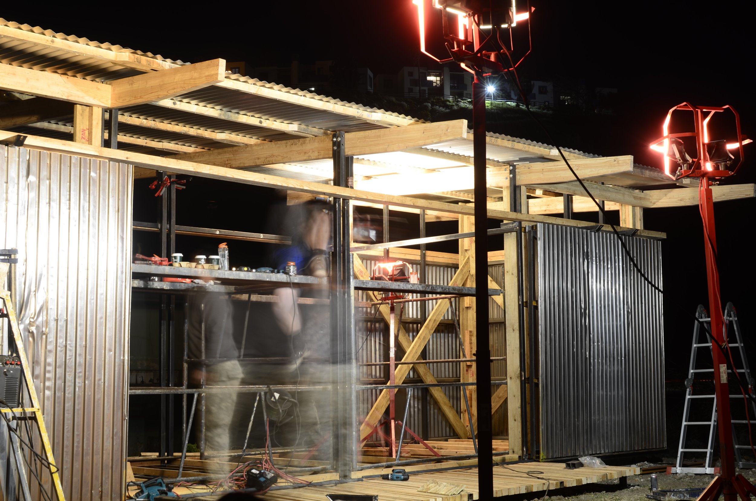 volunteer workers at night working on maker space project