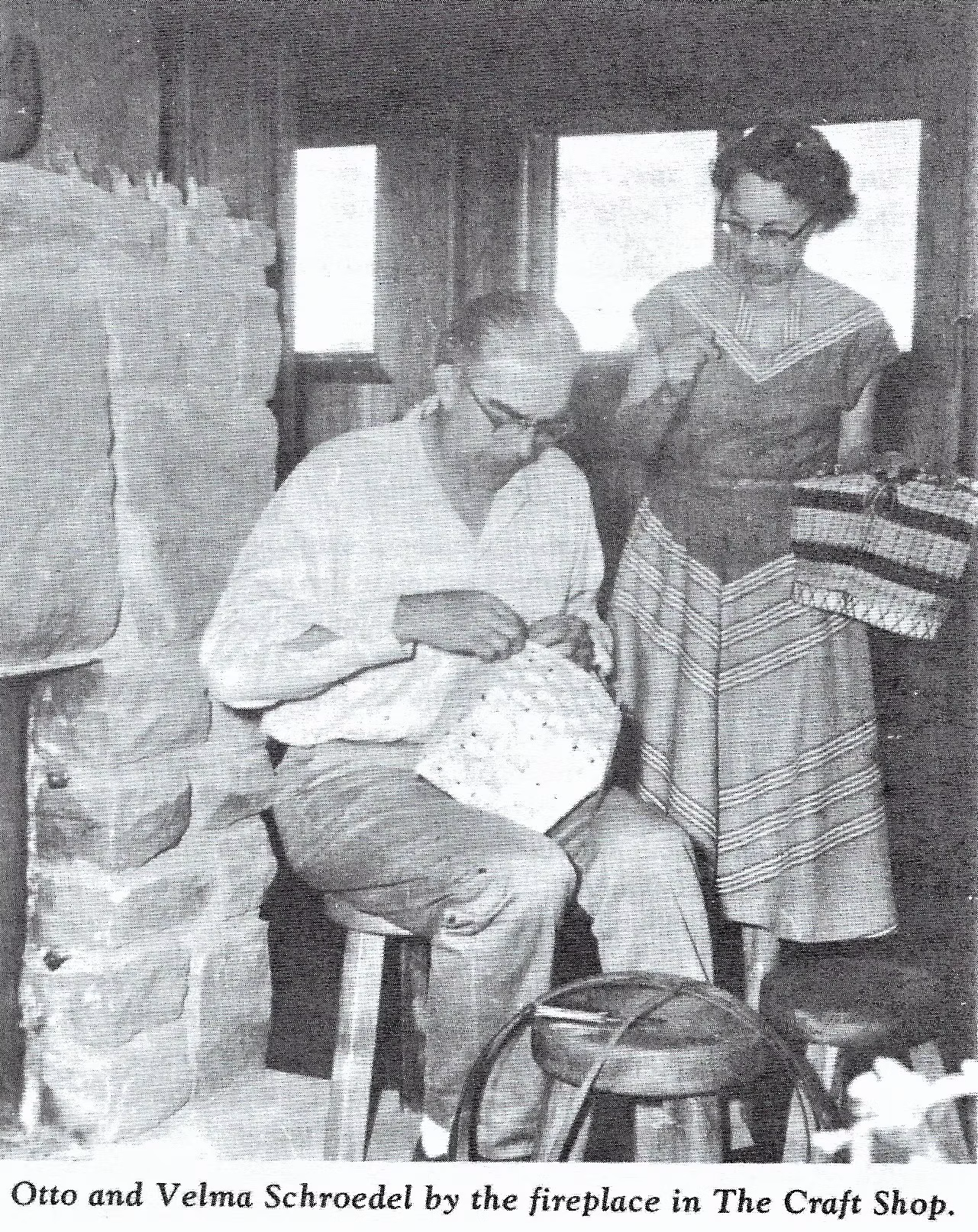 Otto and Velma Schroedel by the fireplace in Woods Hall Craft Shop.