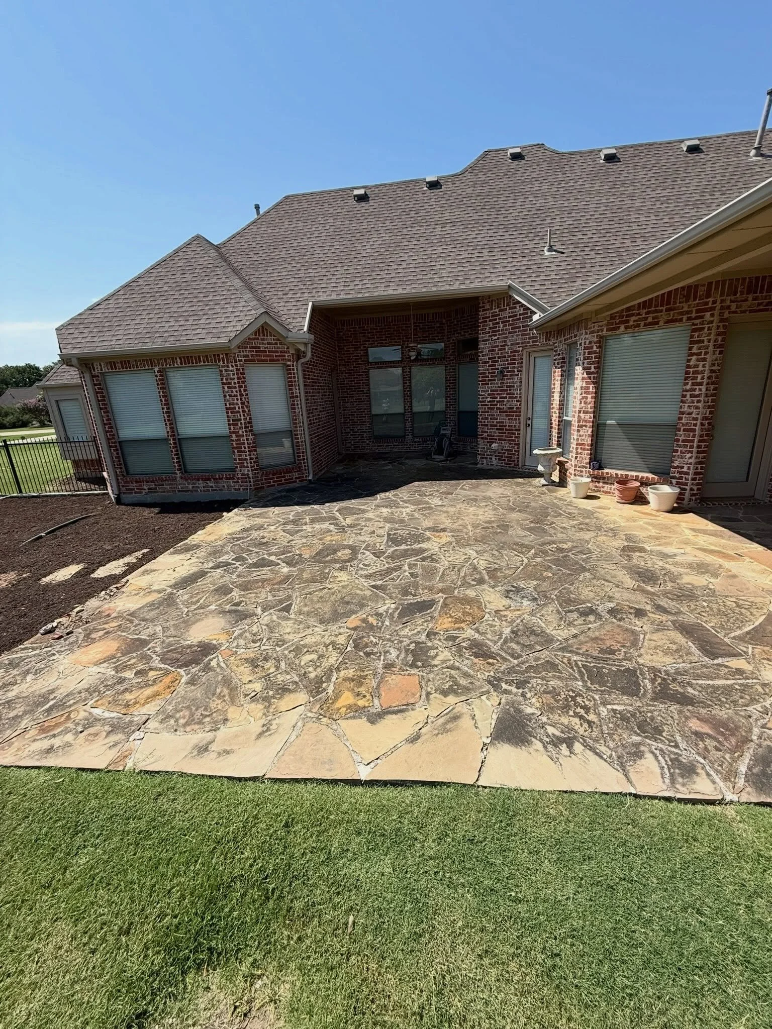 This patio didn&rsquo;t need replacing. It needed THIS. 

Years of dirt and outdoor buildup had completely changed the look of this stone. The natural color was still there it was just hiding underneath.

After a thorough pressure washing, look at th