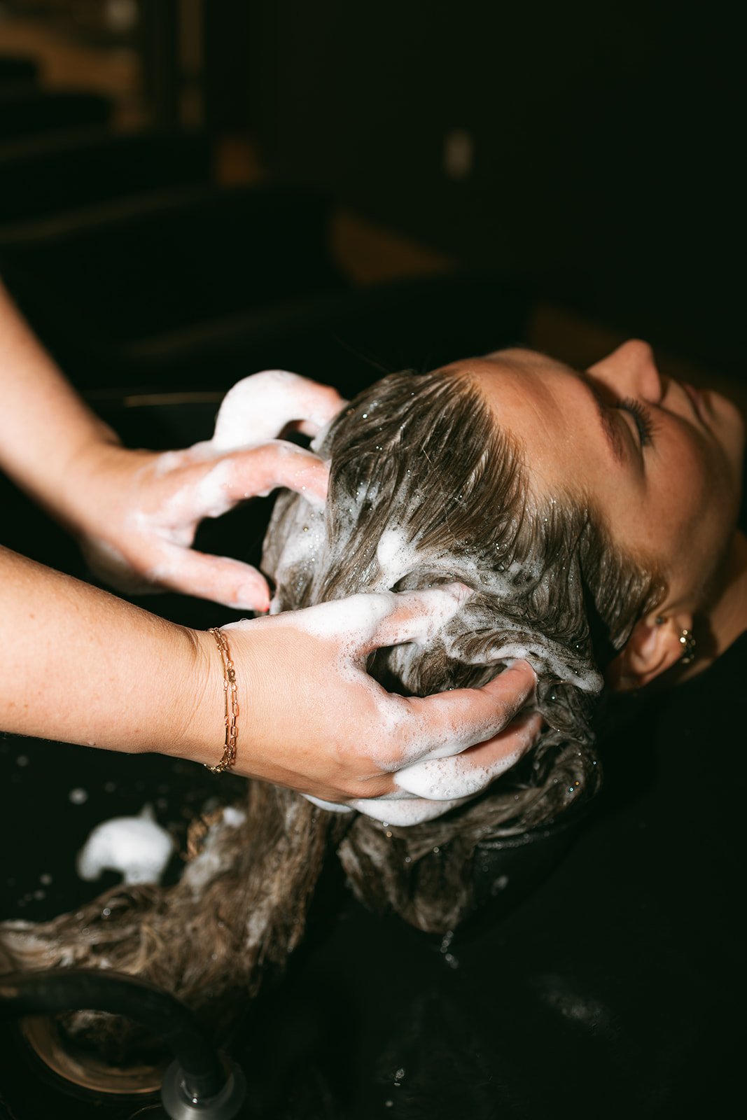 RIPPLE hair product being used during styling at Symmetrie Studios