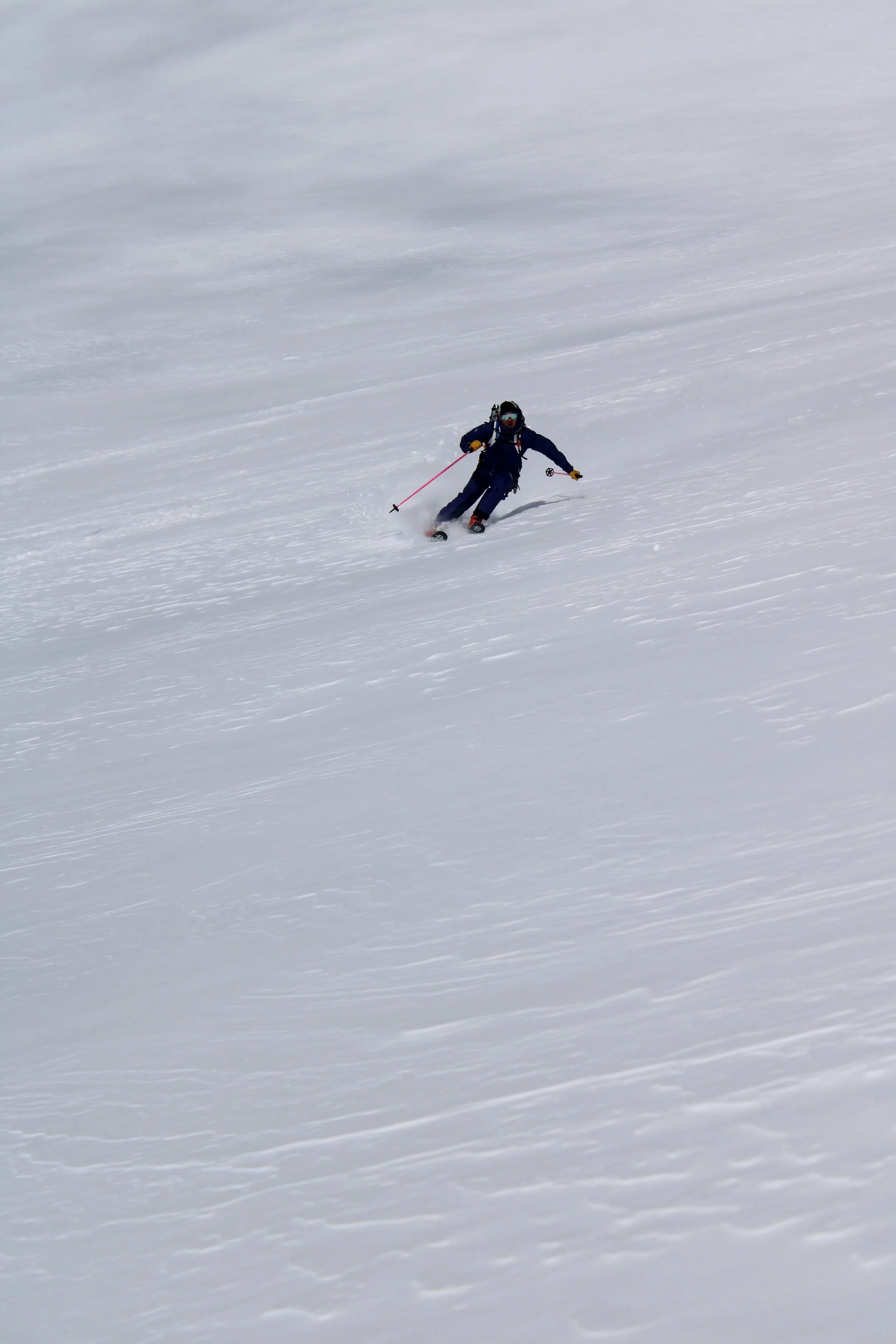 A person skiing on a snow-covered slope.