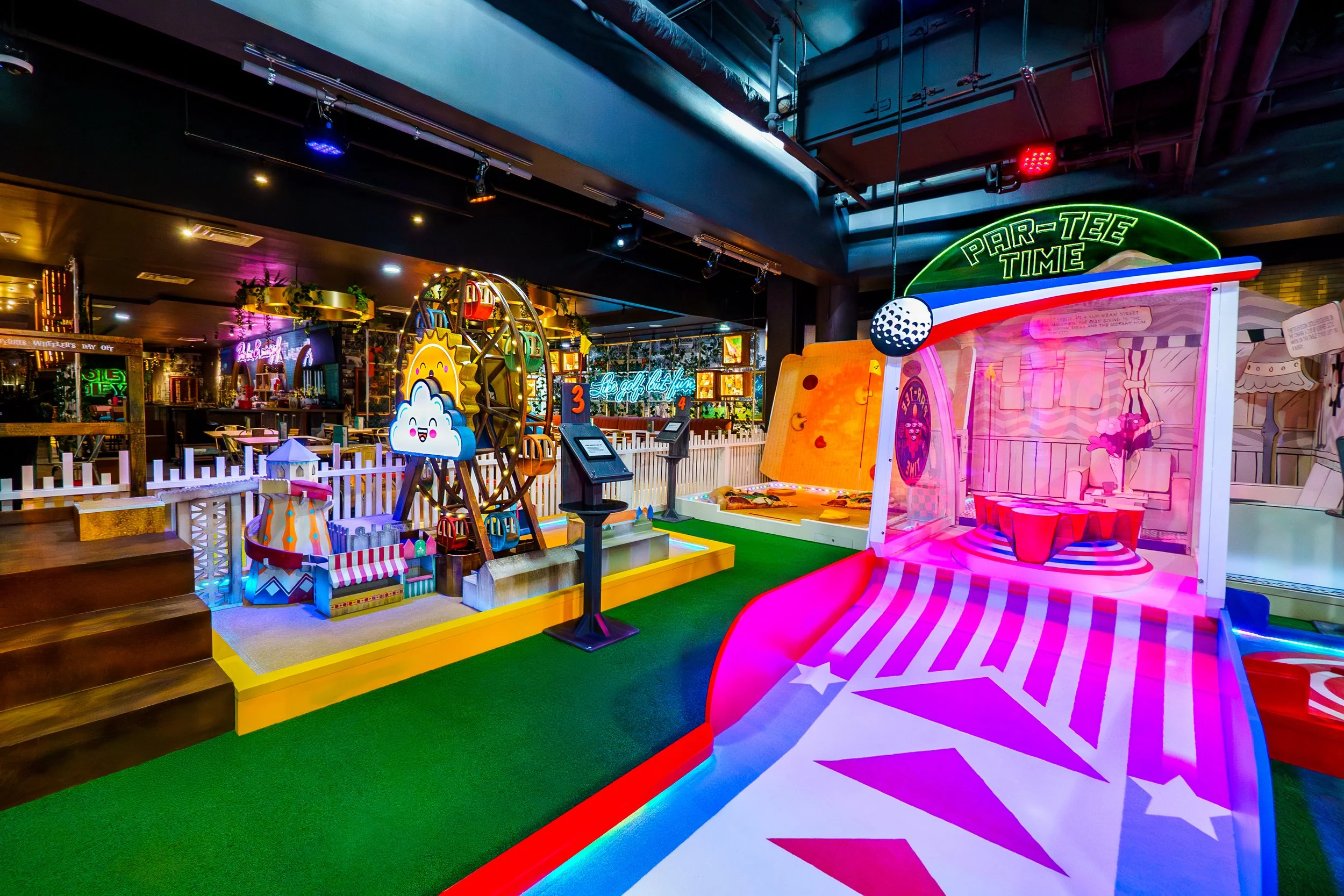 Colorful indoor mini-golf course with various game elements, neon signs, and playful decorations.